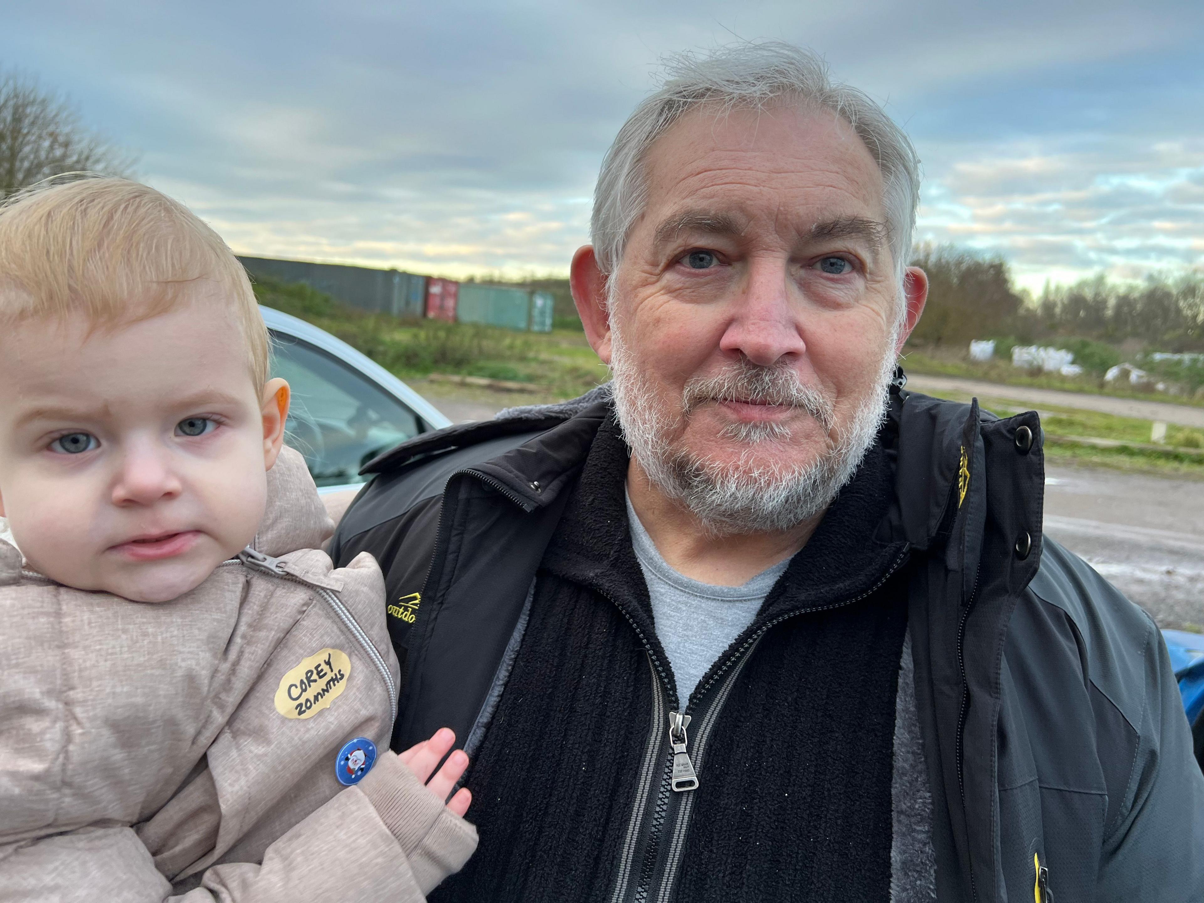 A man holding a toddler