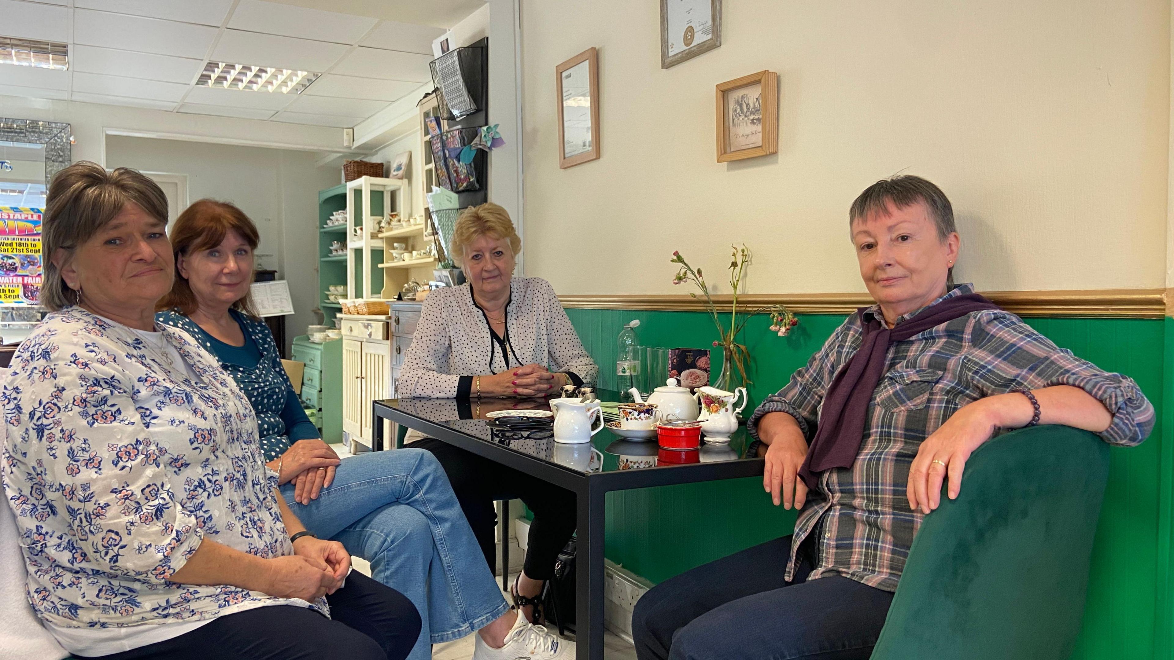 Customers sitting around a table in Odette's Tearoom