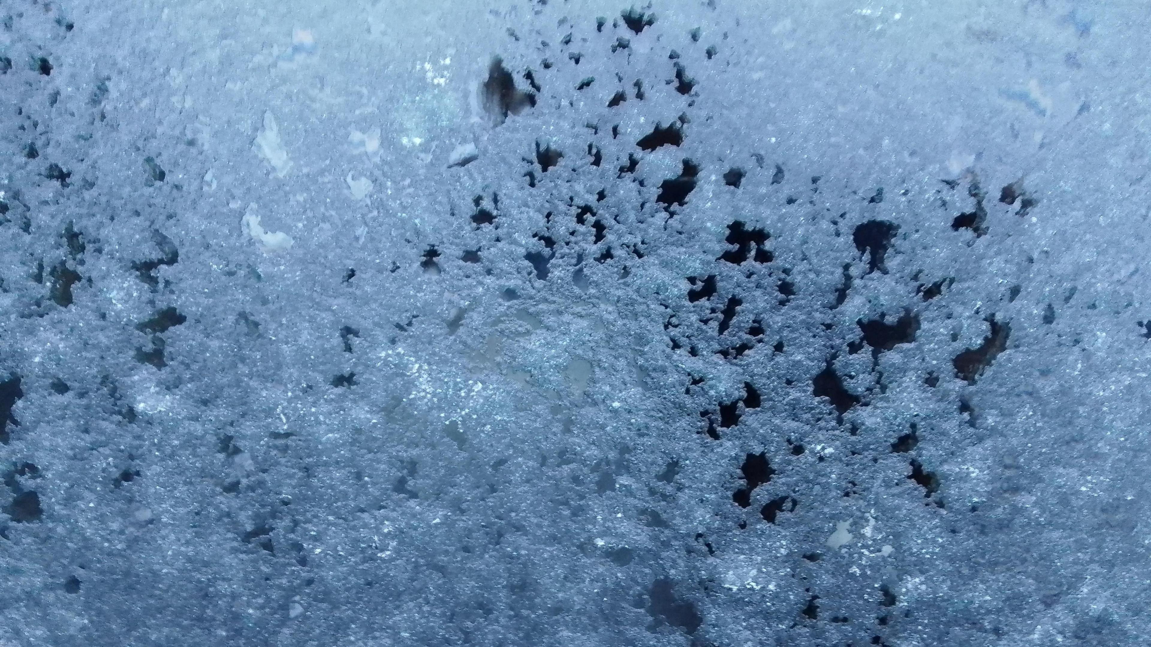 Close up of icy snow on a window