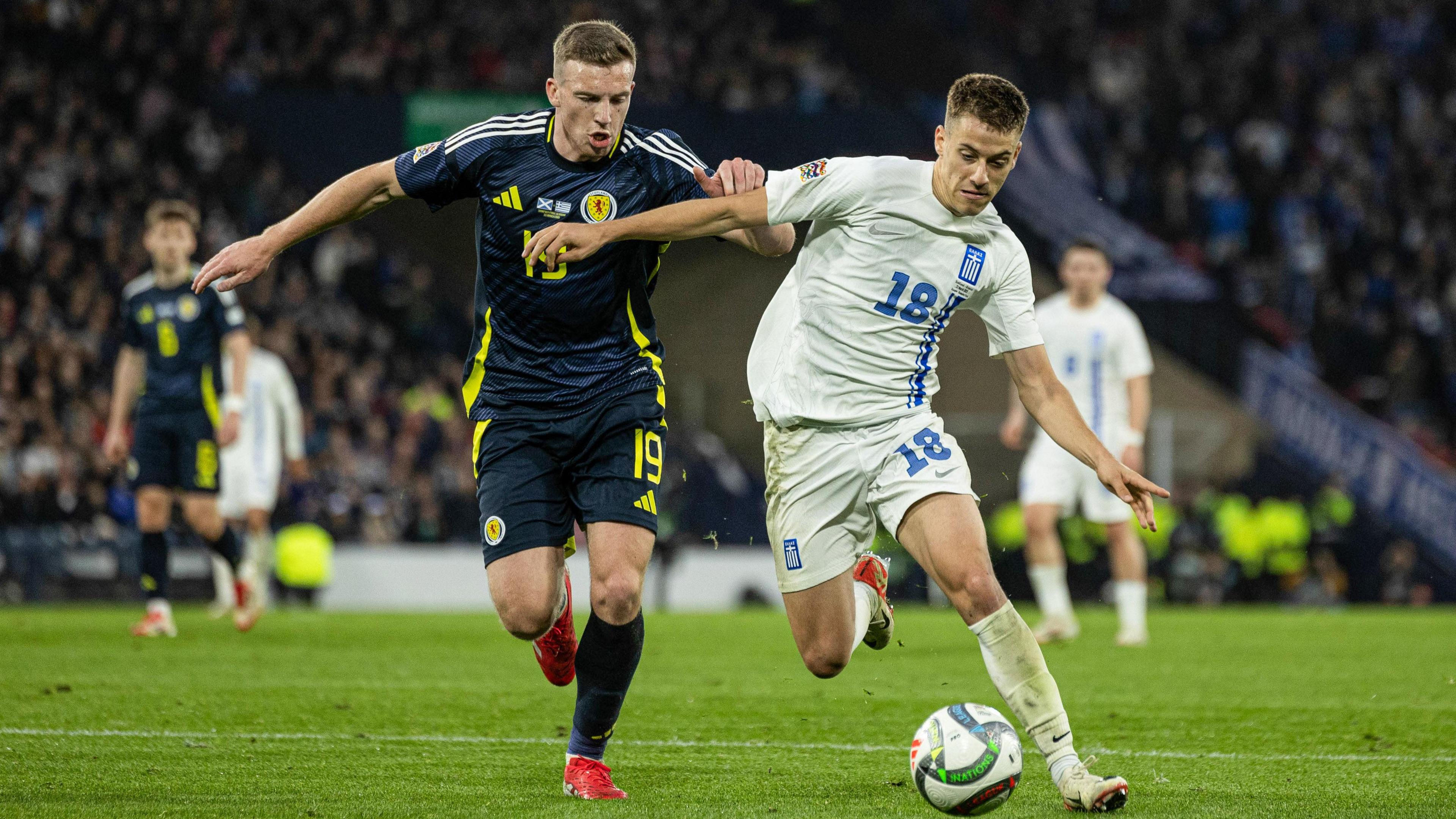 Scotland's Lewis Ferguson and Greece’s Giannis Konstantelias