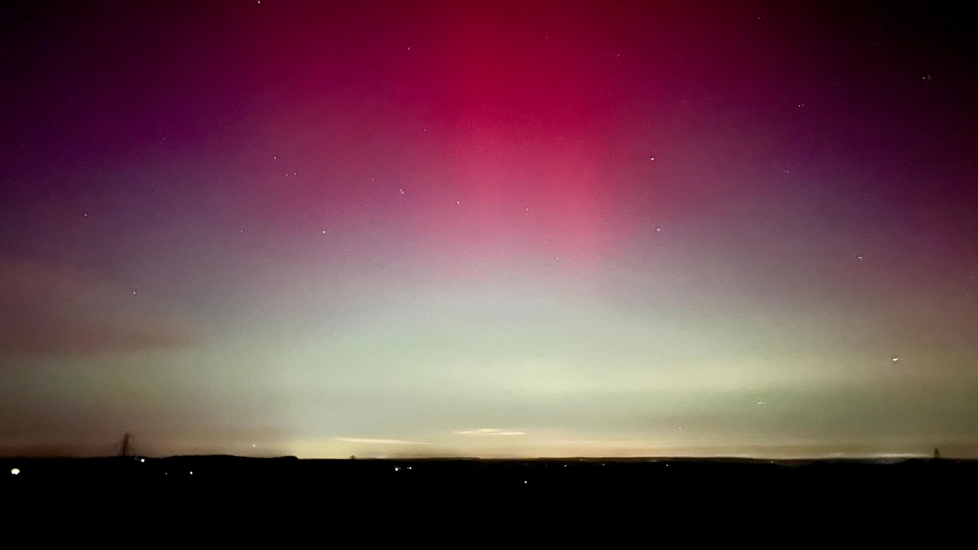 A red and white night sky. 