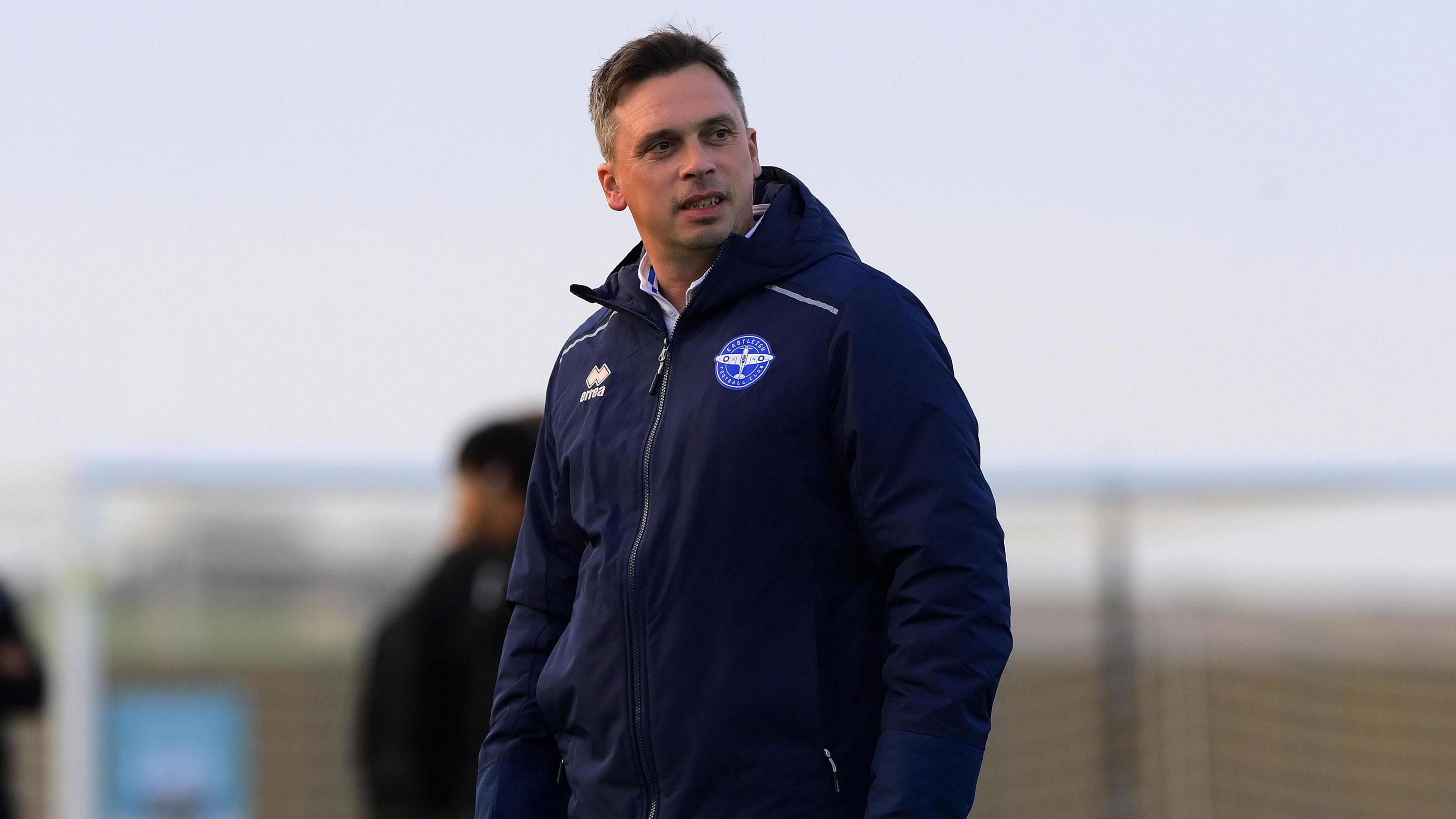Scott Bartlett stands on the touchline as manager of Eastleigh.