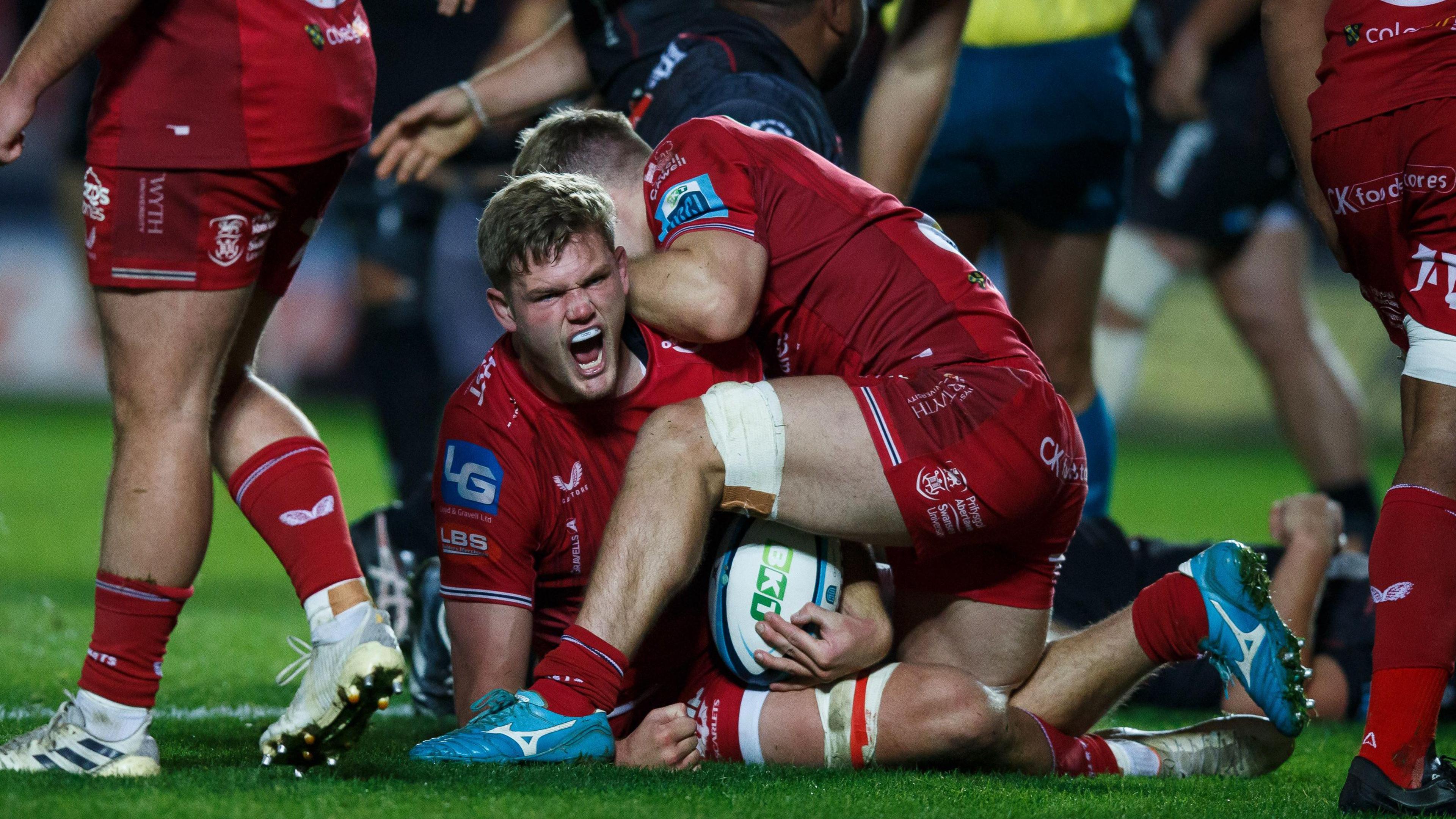 Taine Plumtree celebrates scoring a try