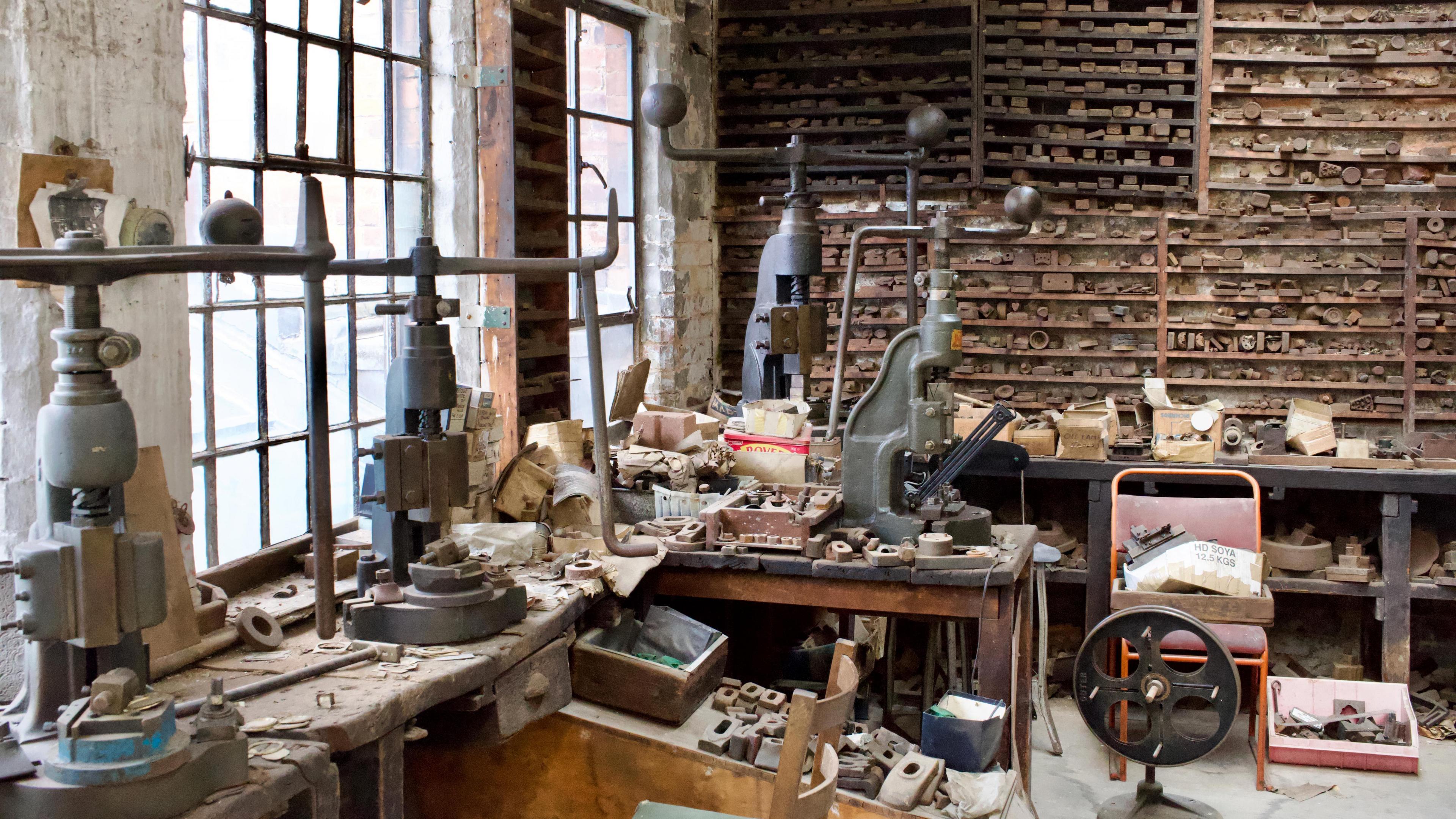 The interior of an old silver factory with stamps and presses. The interior is as if the factory was still open today