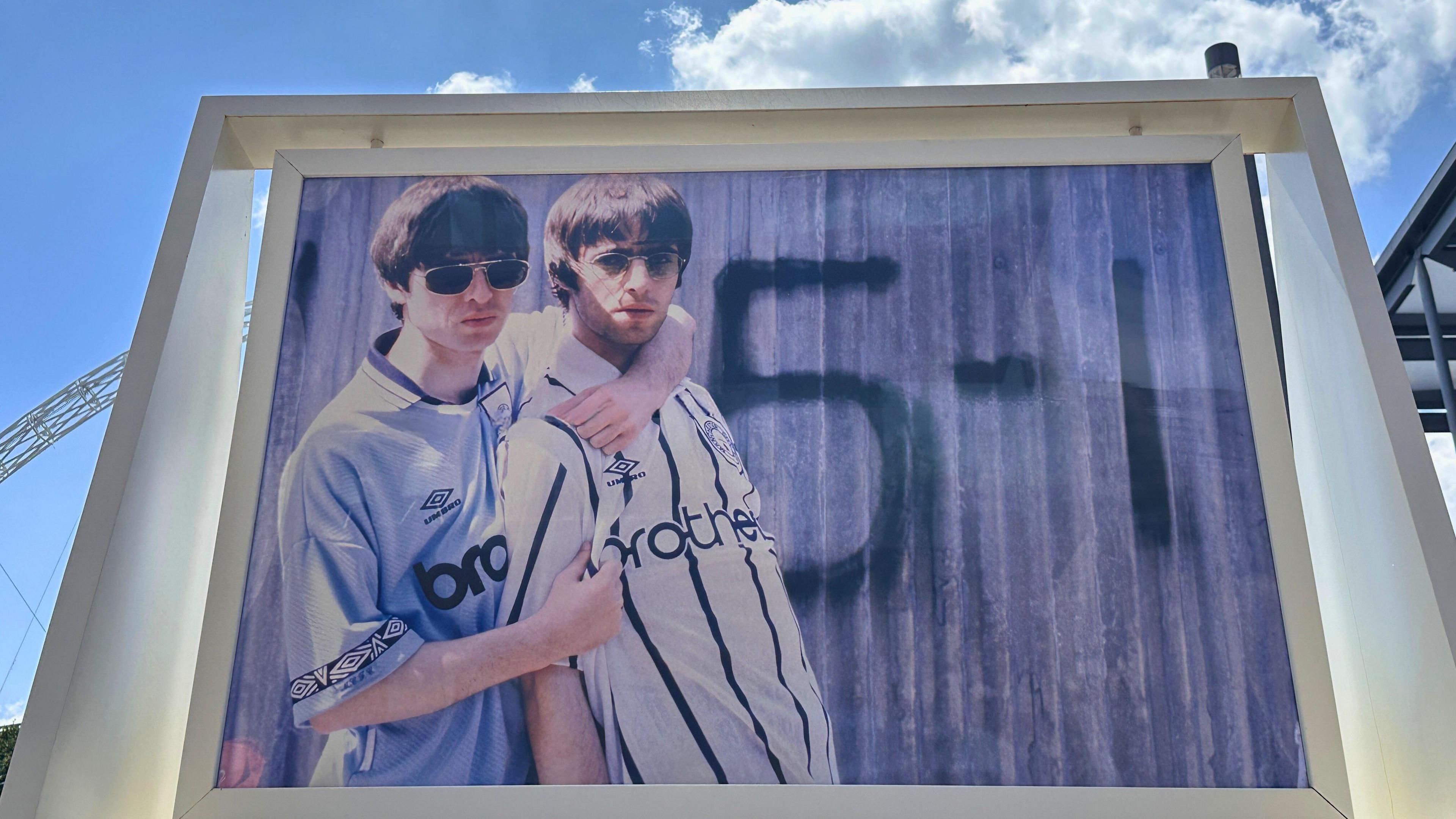 both brothers pictured where 'brother' football t-shirts with a sort of embrace and sprayed '5-1' on a fence in the background