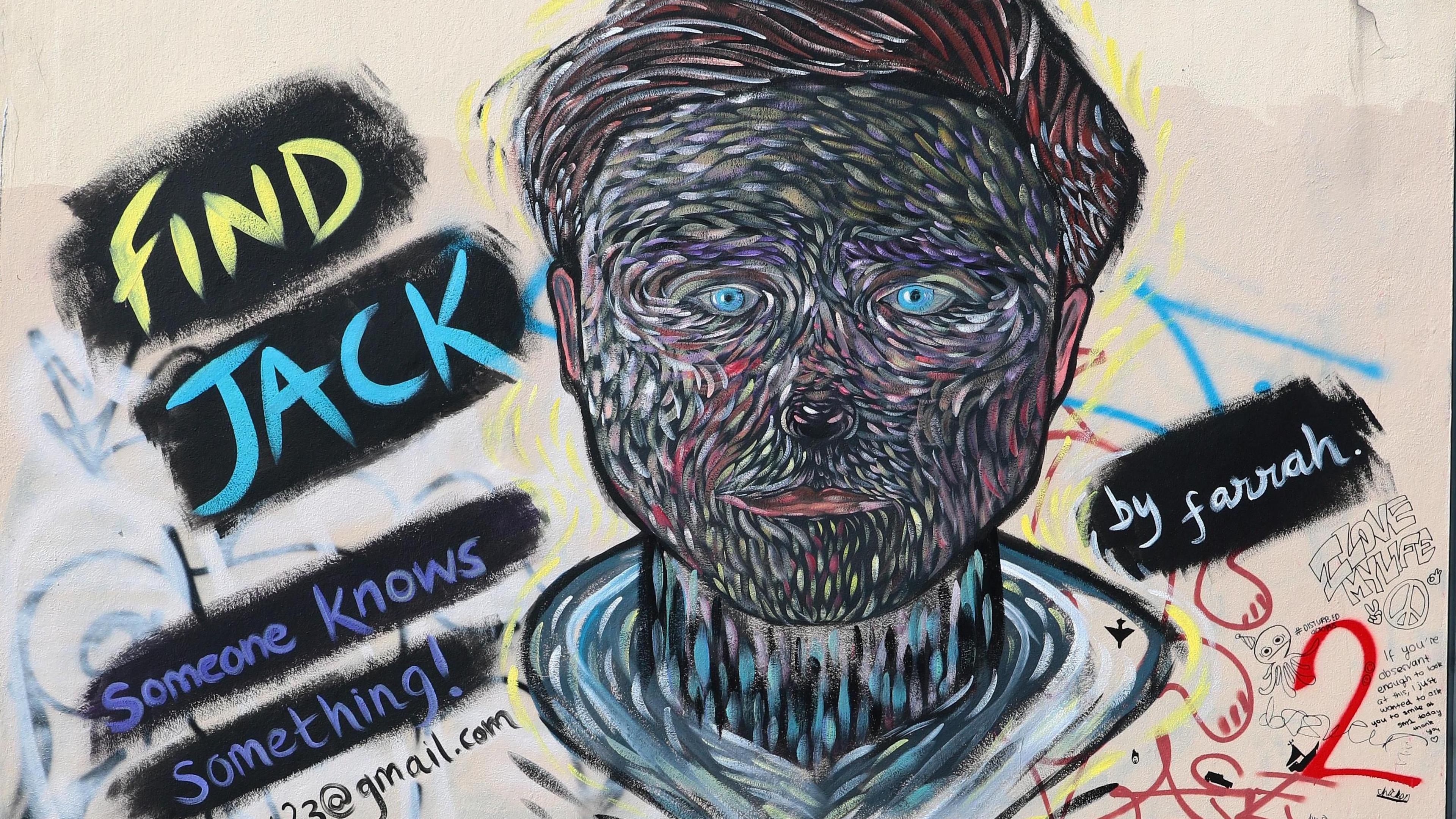 A piece of street art featuring Jack's face with a dog-like adaptation and multicoloured brush strokes