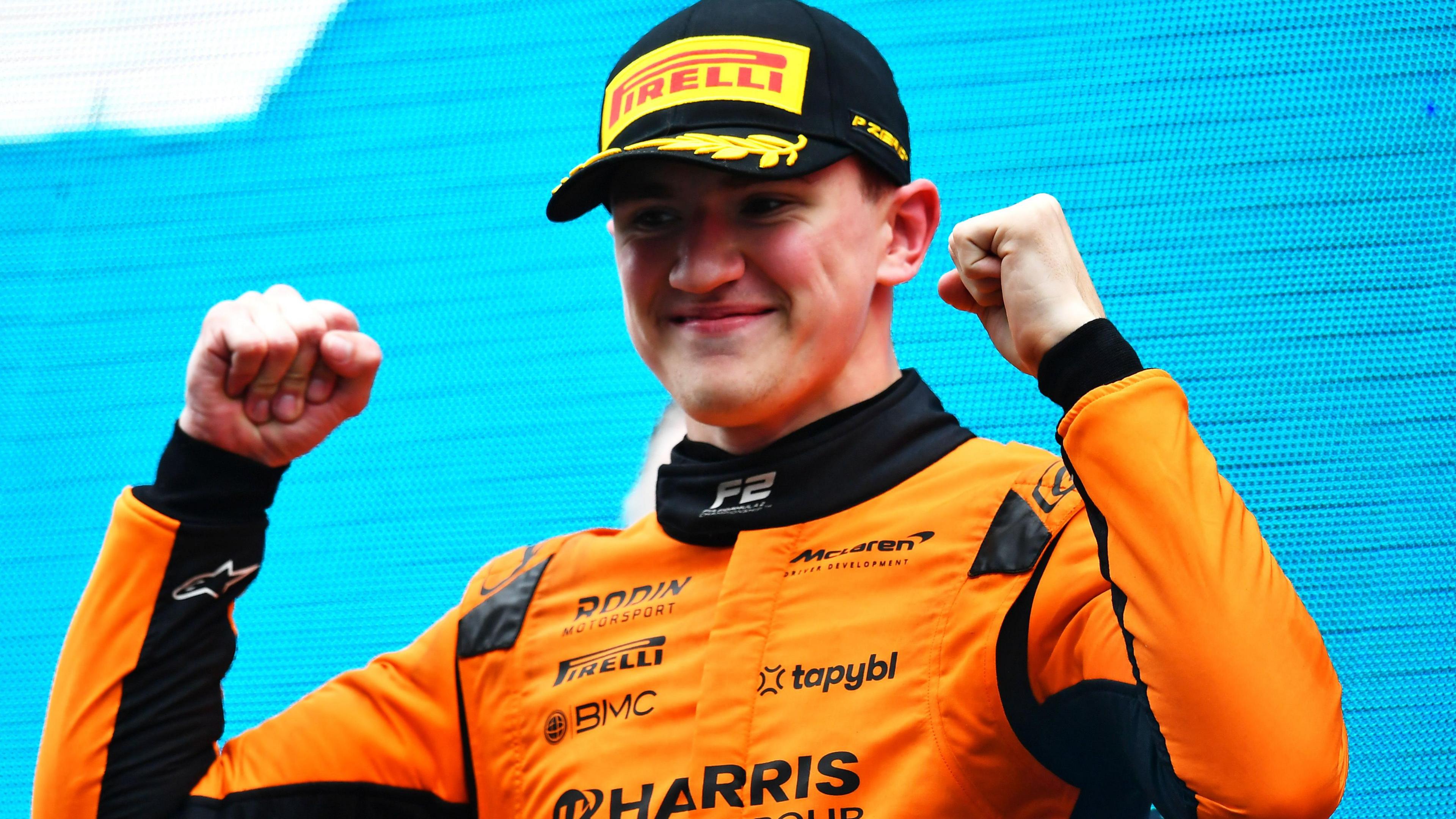 Alex Dunne celebrates on the podium