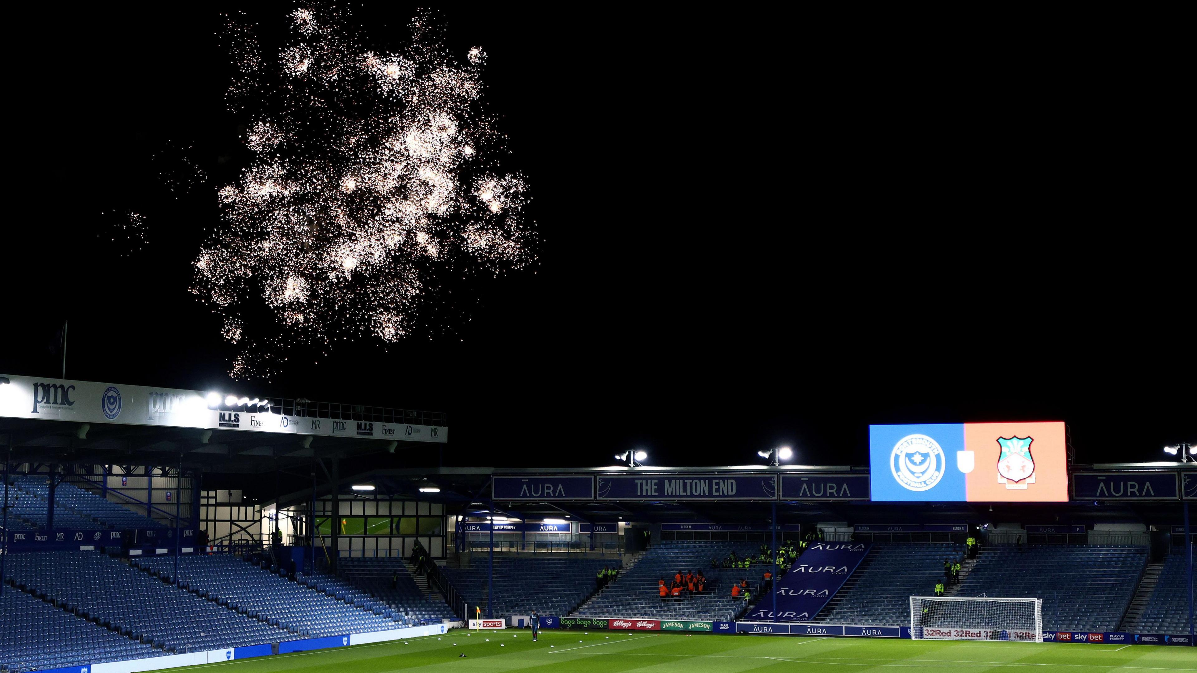 A general view of Fratton Park at night-time as they host Wrexham with fireworks in the background