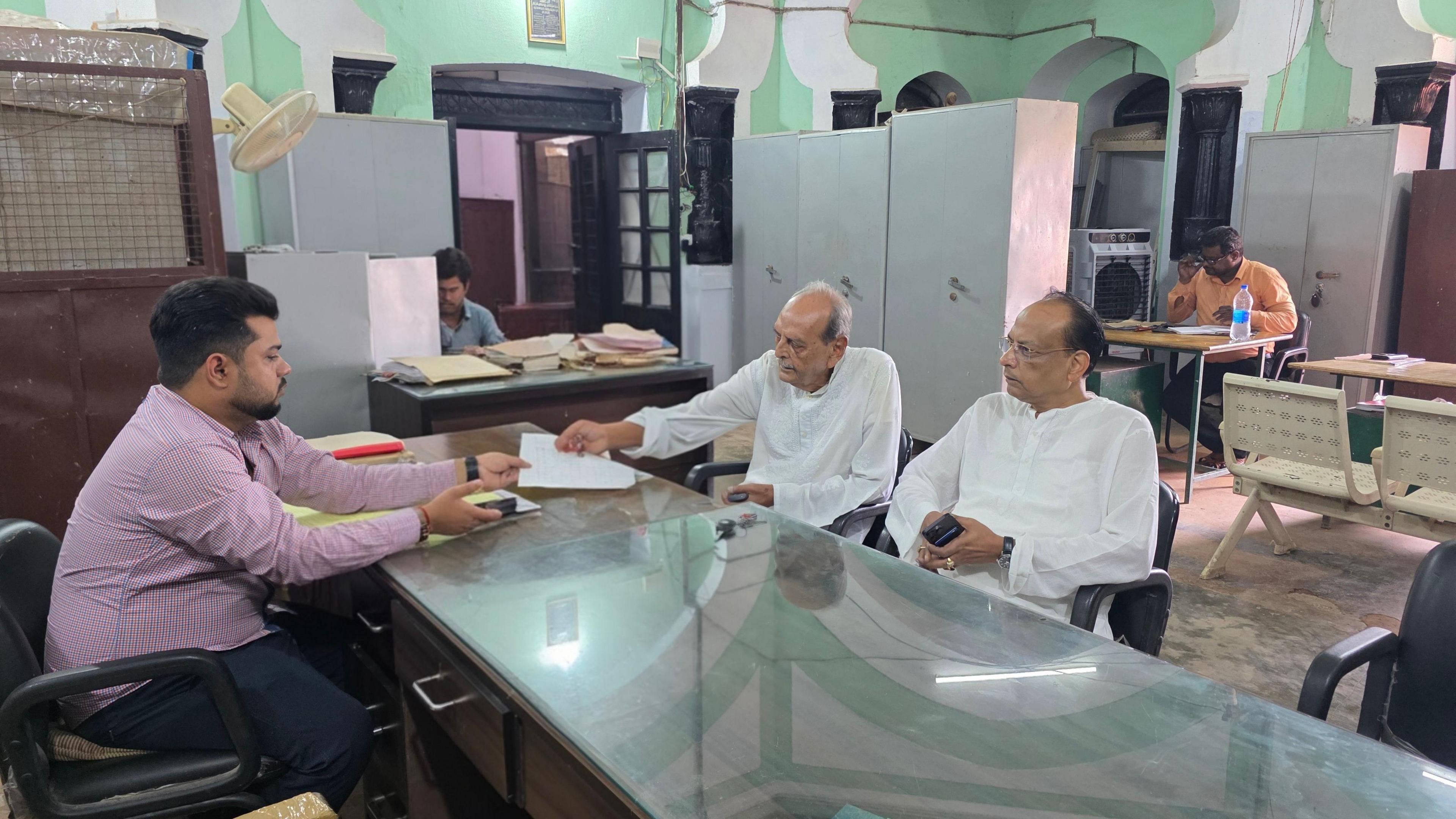Faiyaz Ali Khan and Shikoh Azad sitting inside the Hussainabad Trust Office in Lucknow to collect their pension
