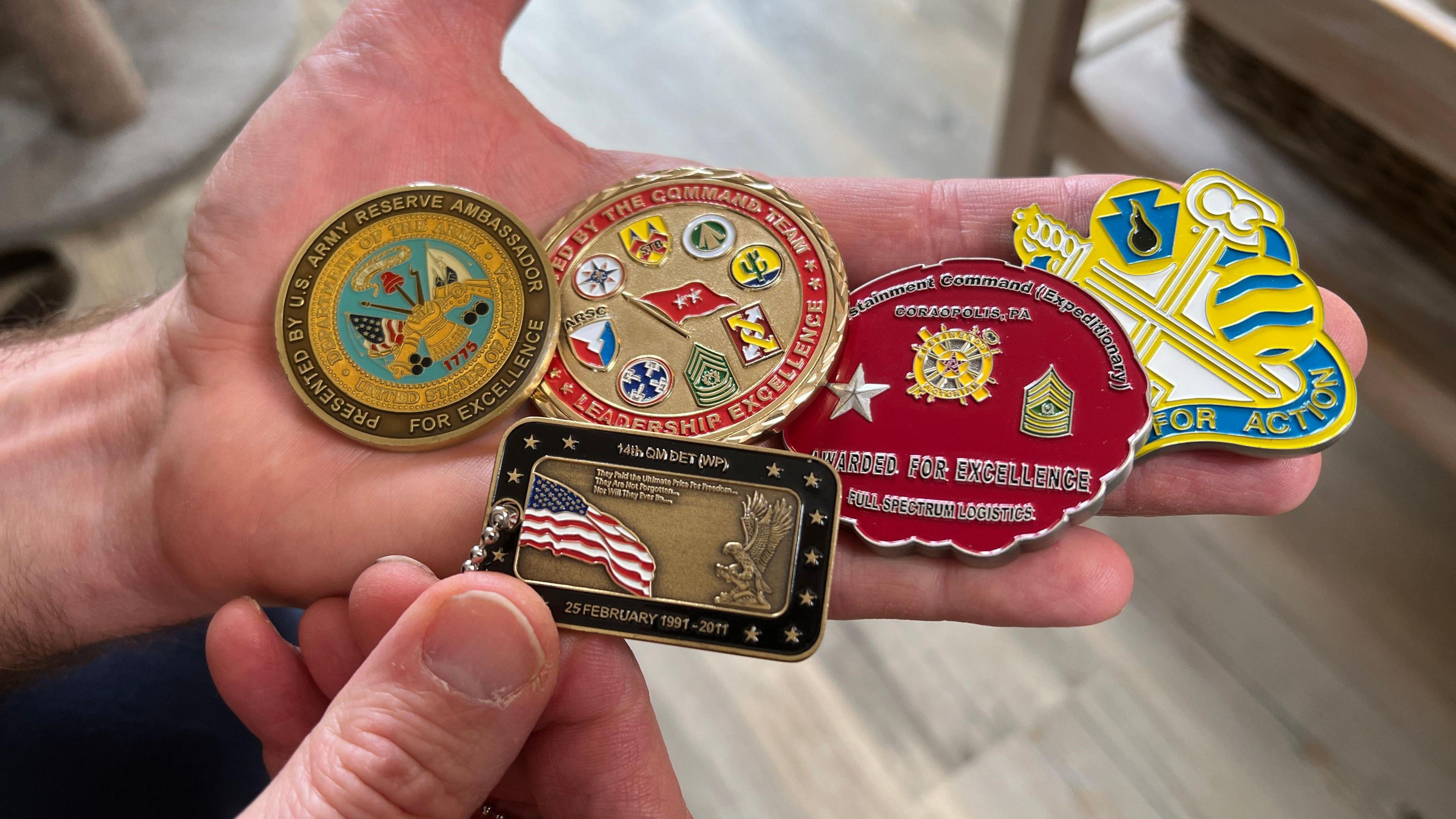 Jim Newman's medals from his time serving for the country, laid out along the palm of his hand