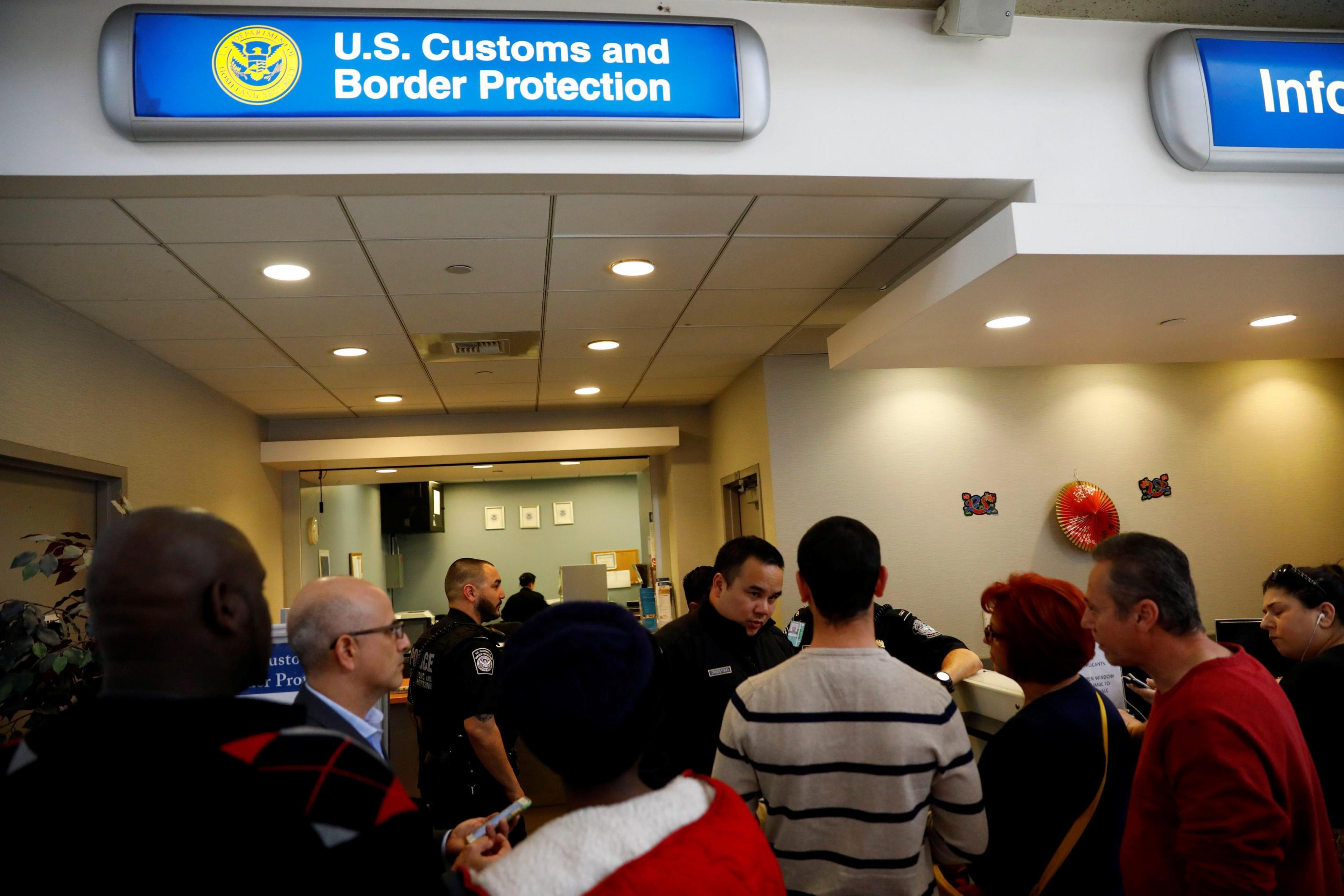 US Customs and Border Protection officers stand outside an office during the travel ban at Los Angeles International Airport (LAX) in Los Angeles, California., 28 January 2017