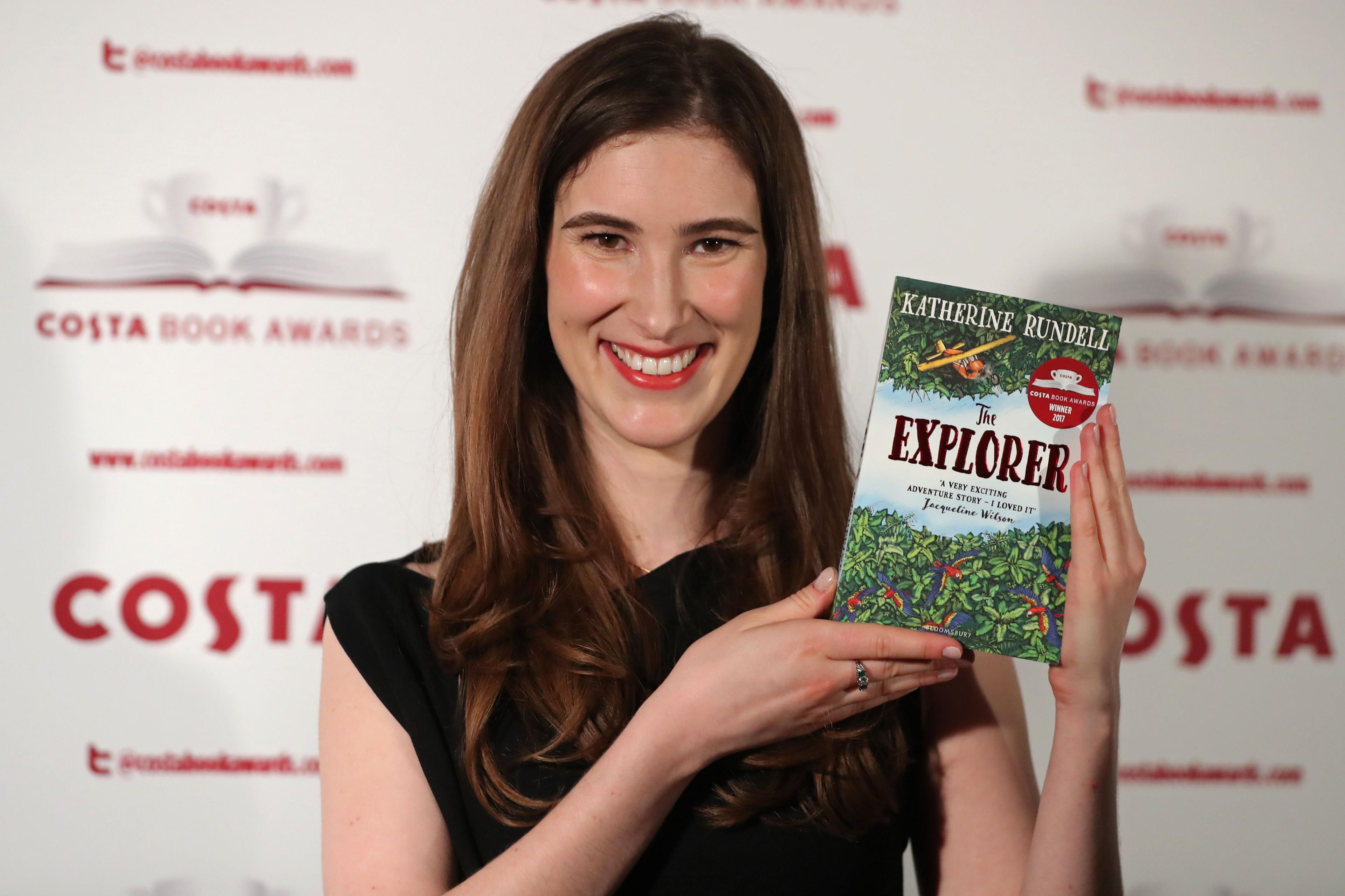 Katherine-rundell-poses-with-book