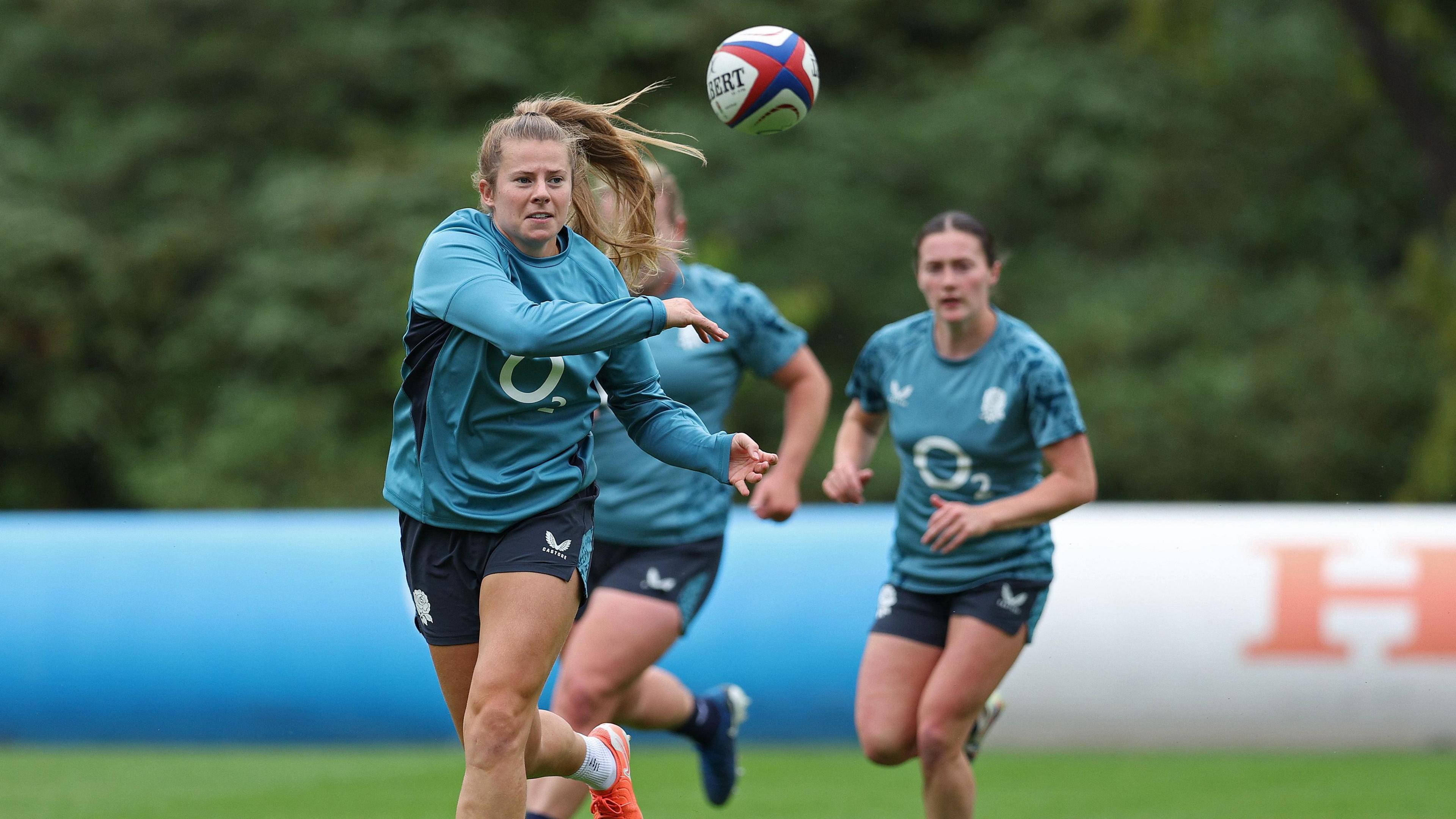 Zoe Harrison throws a pass in training