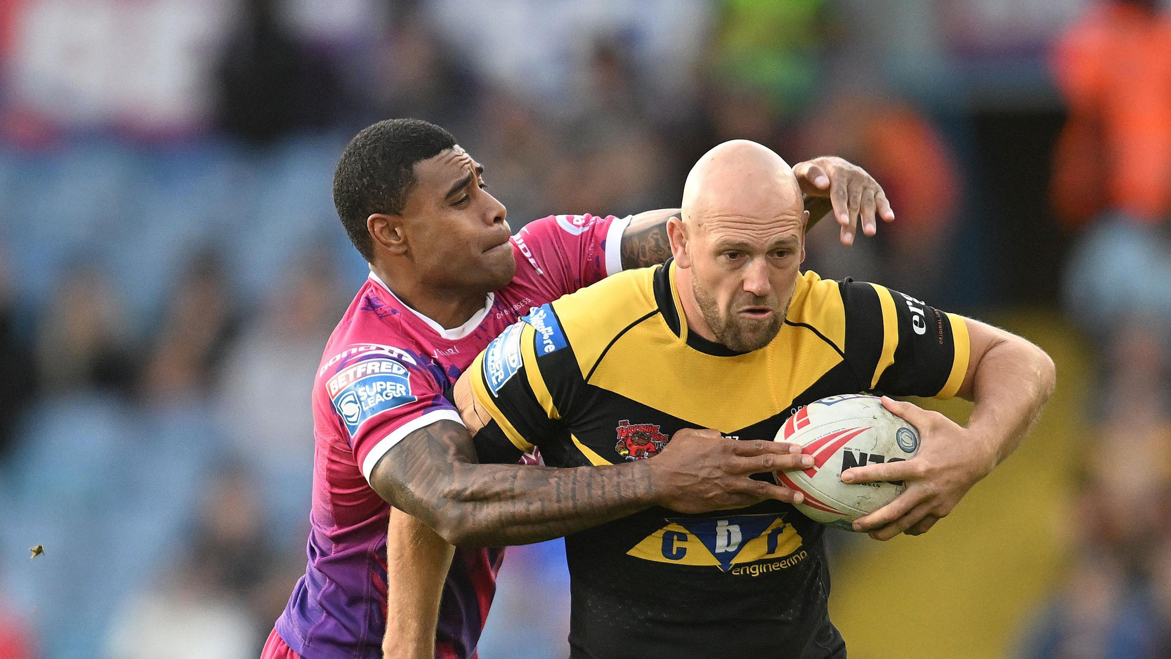 Liam Walsh (right) playing for Castleford Tigers last year 