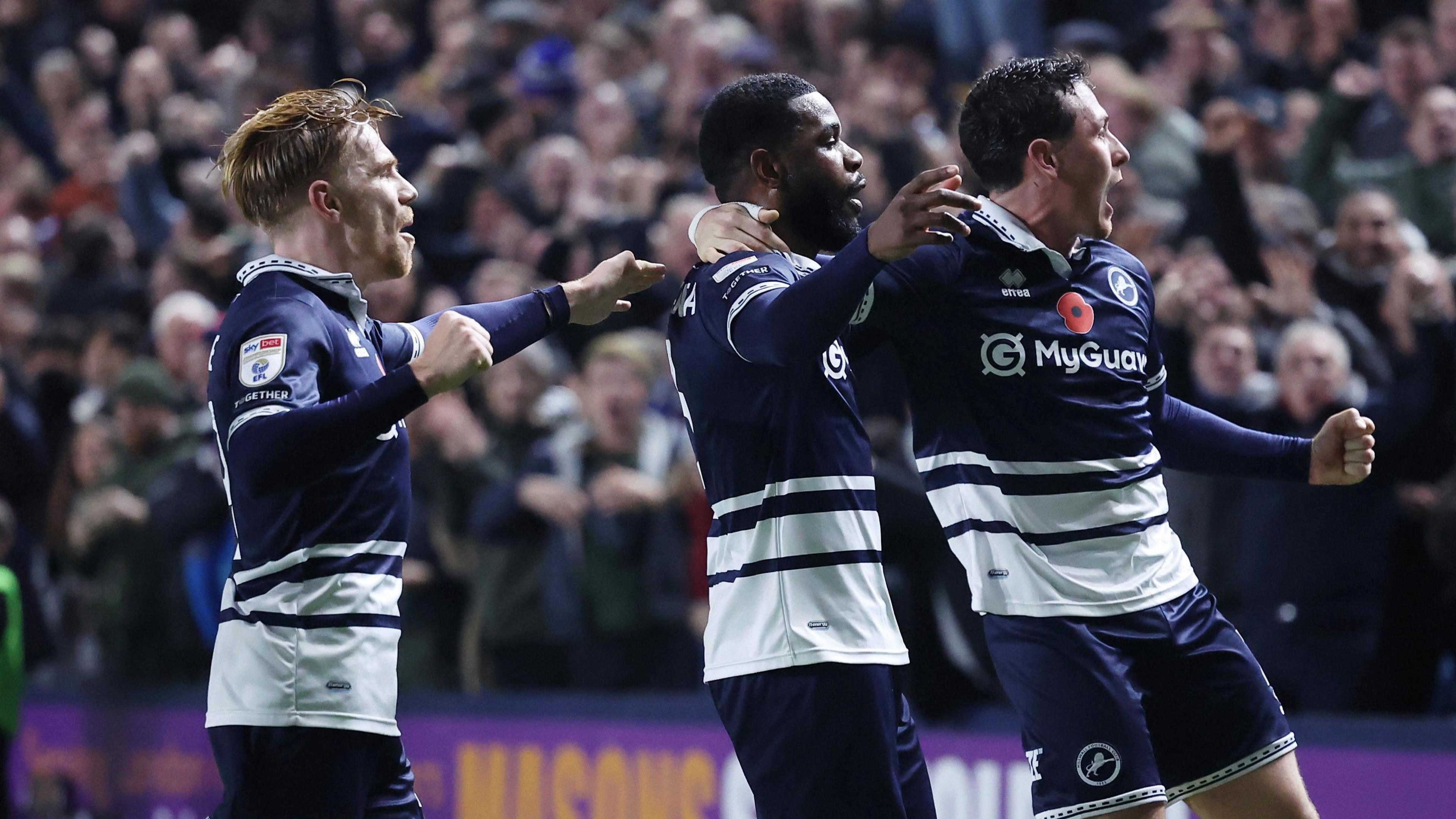 Millwall's Japhet Tanganga celebrates scoring against Leeds United with his team-mates