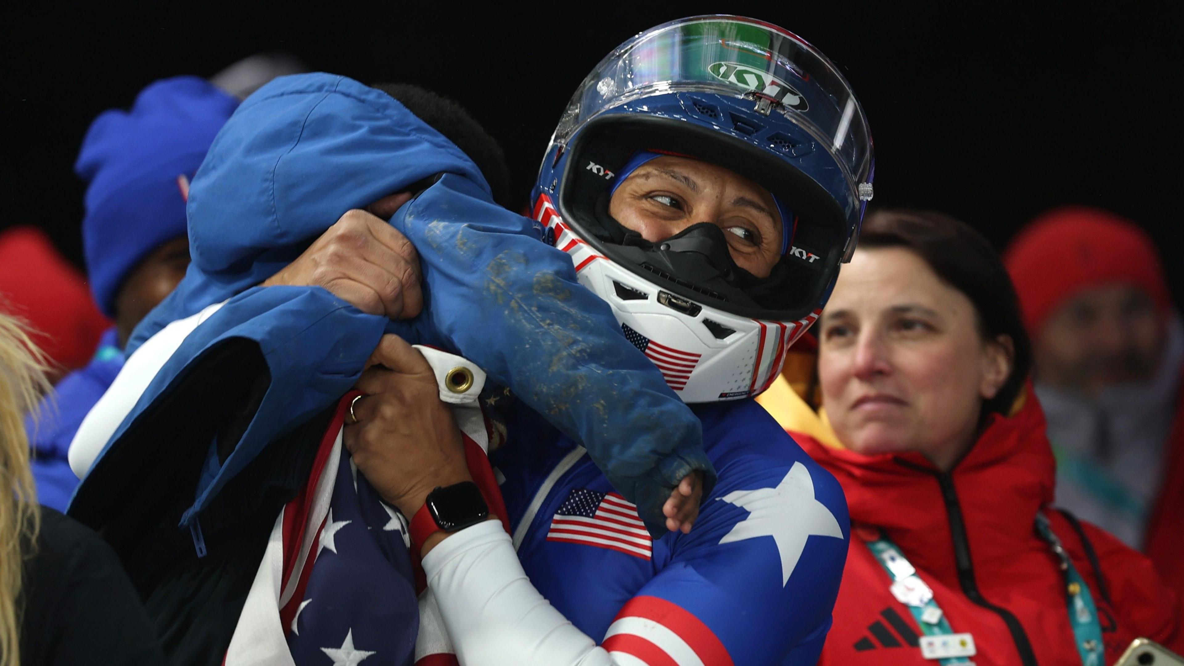 Elana Meyers Taylor celebrates with son after winning Olympic gold in Cortina