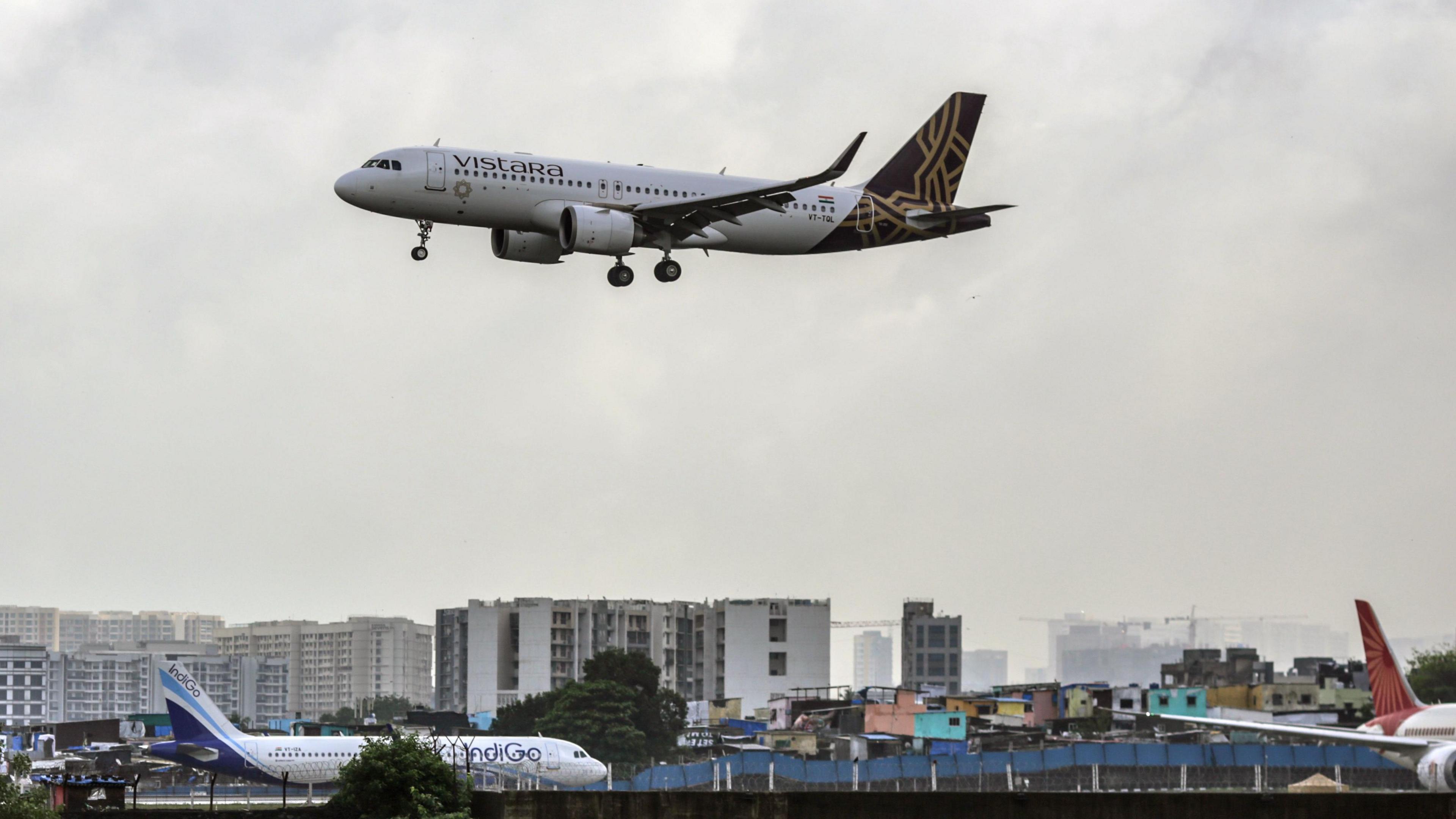 A Vistara aircraft, operated by Tata SIA Airlines Ltd., prepares to land at Chhatrapati Shivaji Maharaj International Airport in Mumbai, India, on Monday, July 3, 2023. Domestic airlines are dealing with shortages of workers and planes after both were sidelined during the pandemic. Photographer: Dhiraj Singh/Bloomberg via Getty Images
