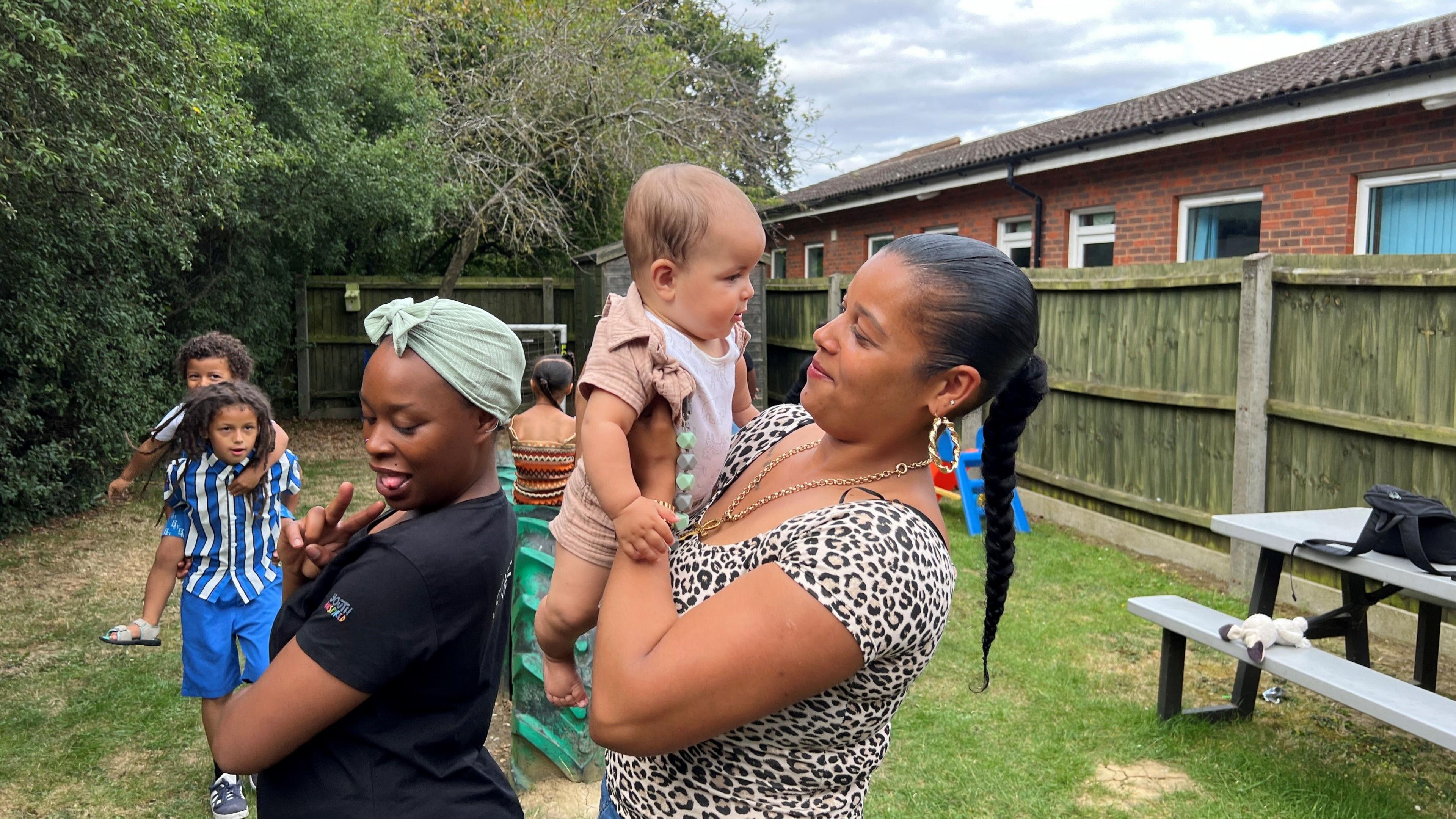 Mums and children enjoying the Saturday school garden. 