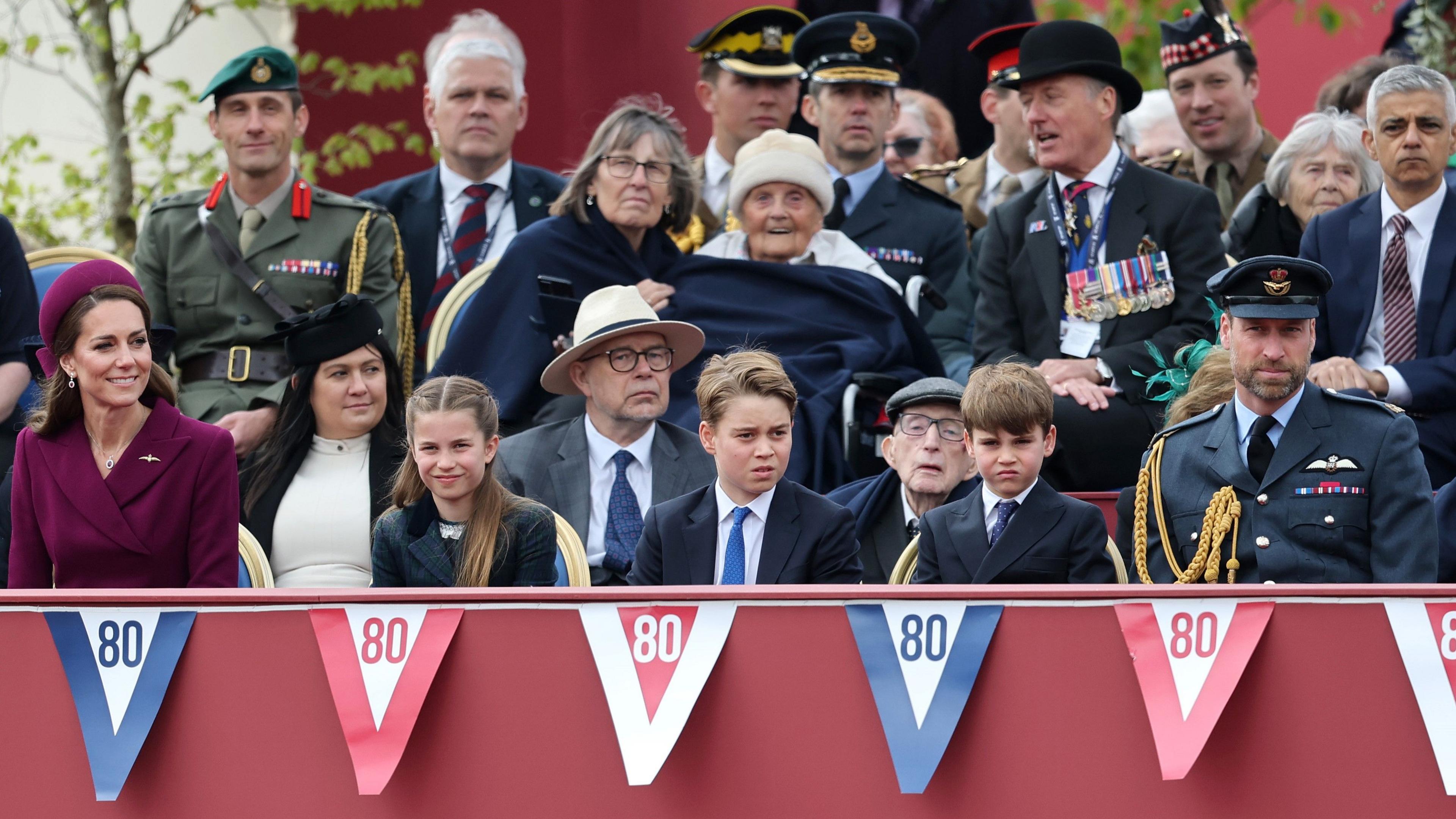 Catherine, Princess of Wales, Princess Charlotte, Prince George, Prince Louis and Prince William during the military procession to mark the 80th anniversary of VE Day.