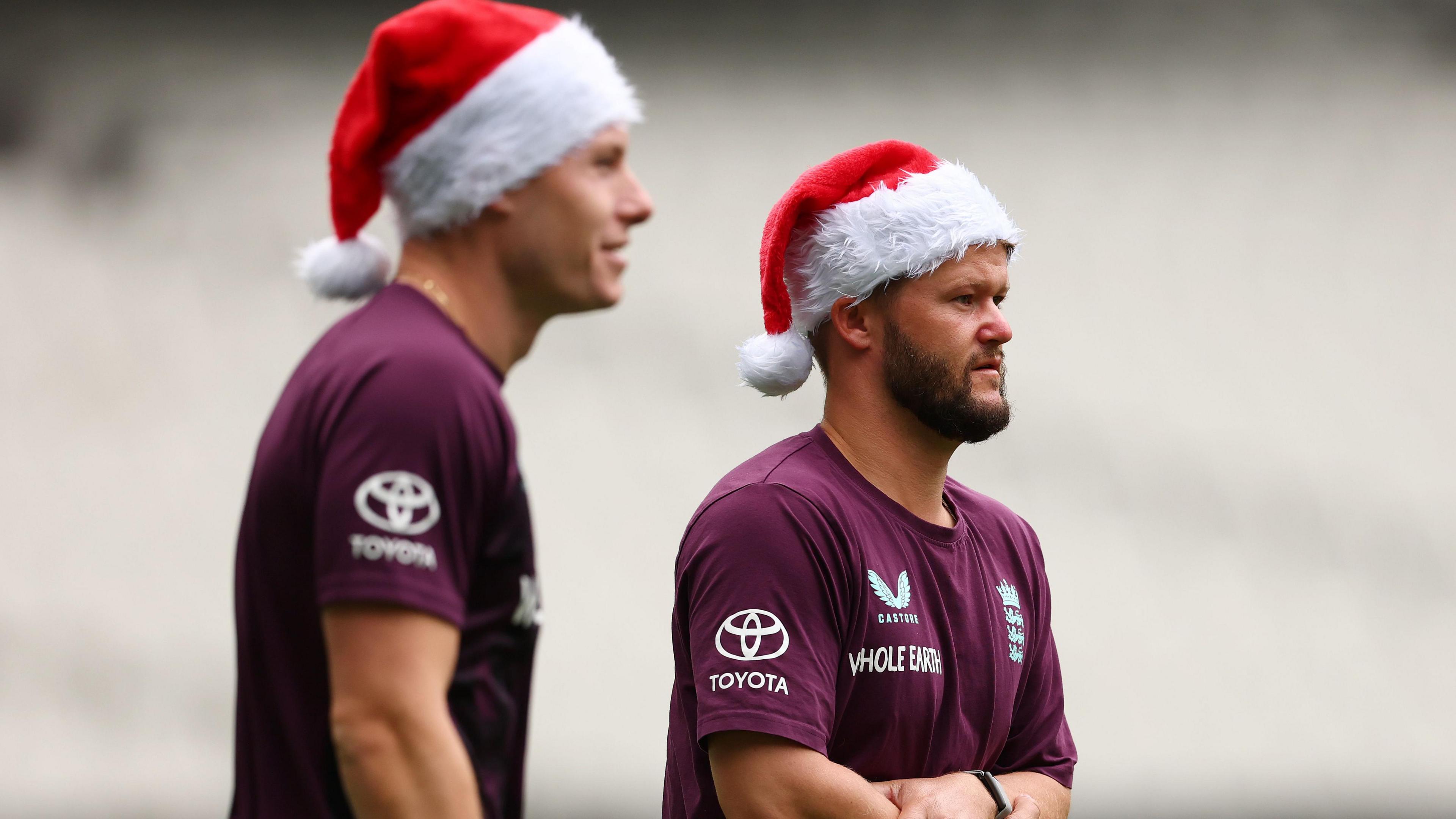 Matthew Potts and Ben Duckett in red and white Father Christmas hats