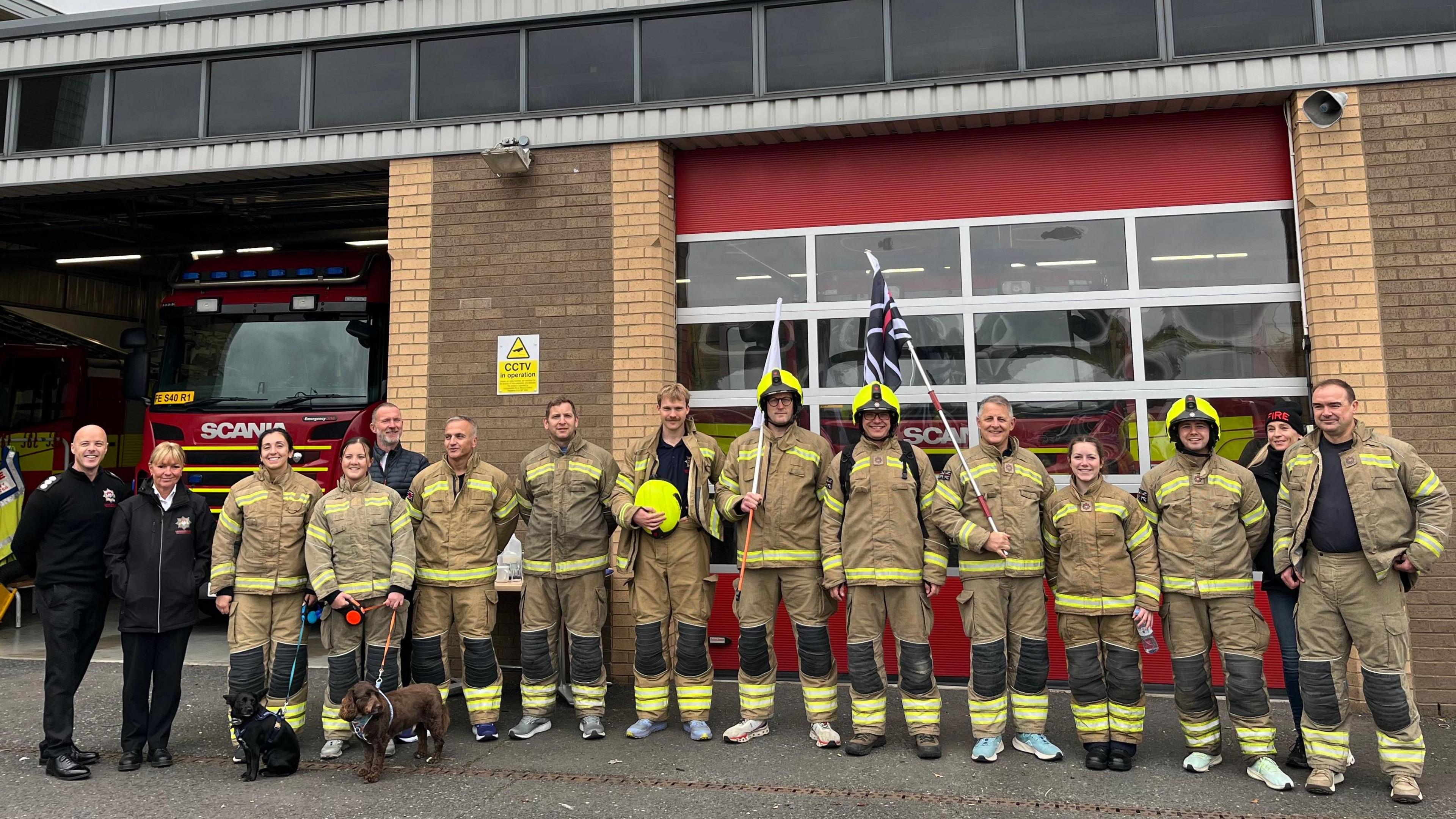 Firefighters gathered in front of the Southern Fire Station at Fosse Park