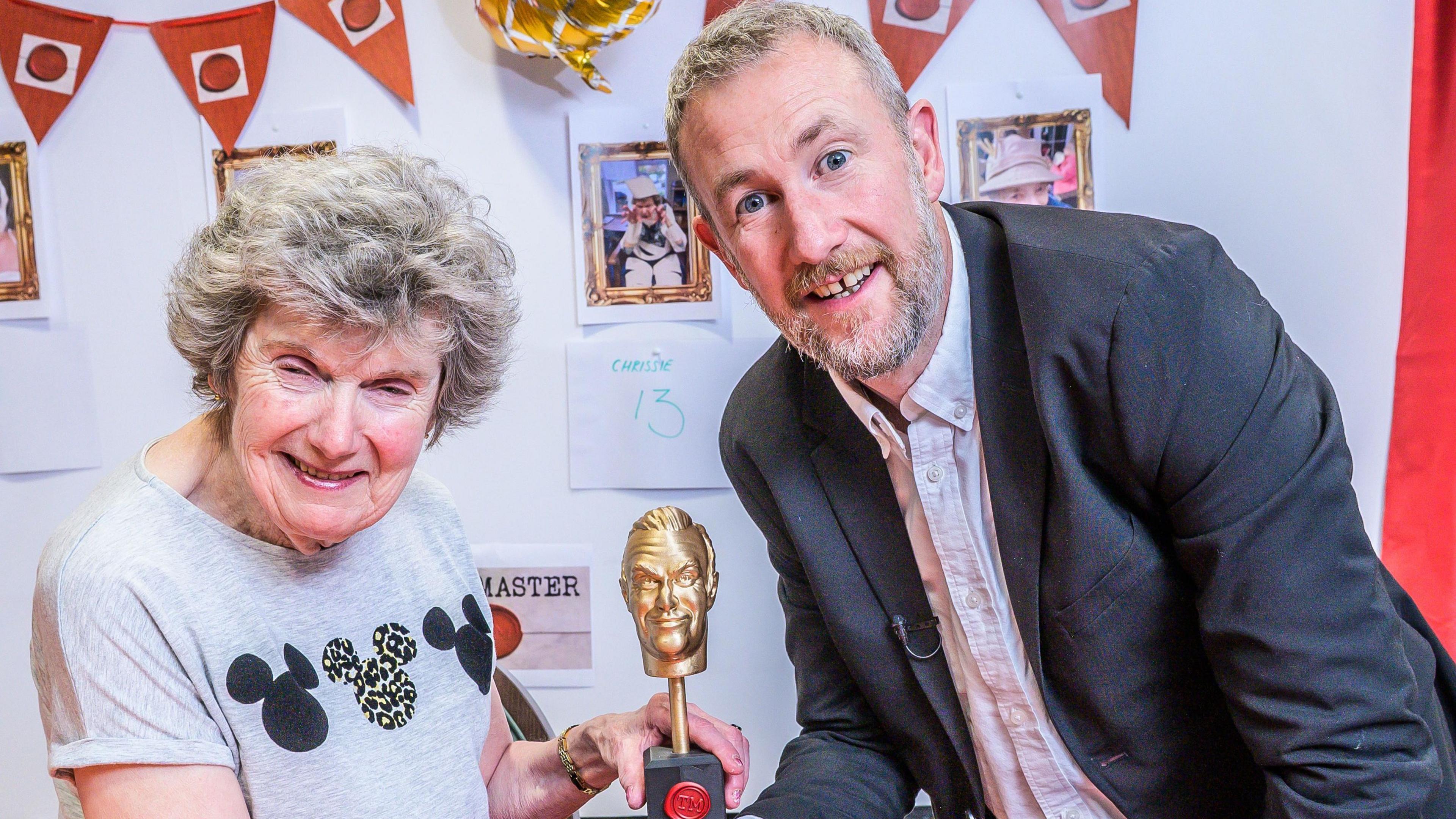 Taskmaster host Alex Horne with winner Christine Jesson at Seccombe Court care home in Adderbury.