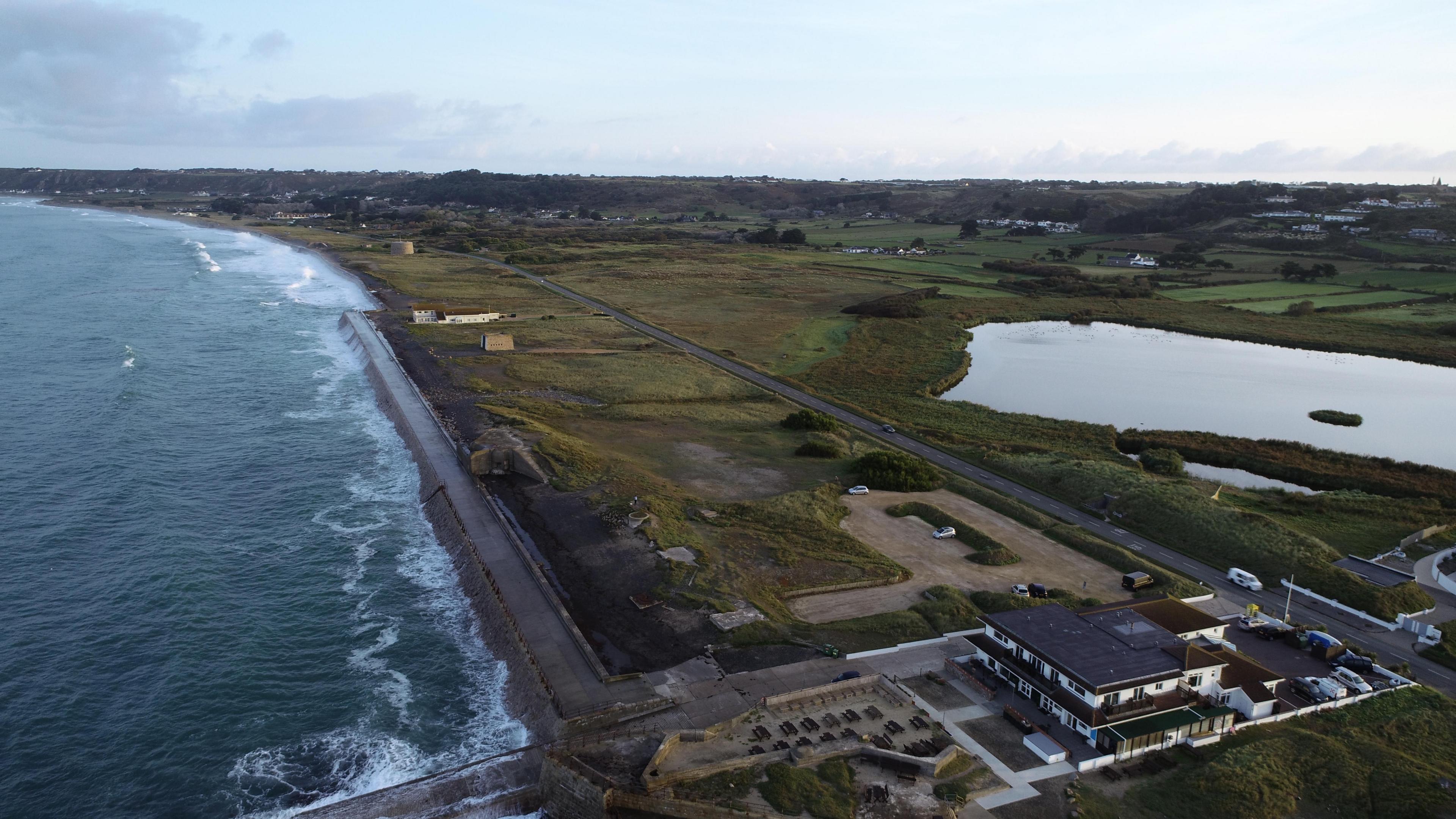 Arial shot of St Ouen's Bay and La Mare au Seigneur pond
