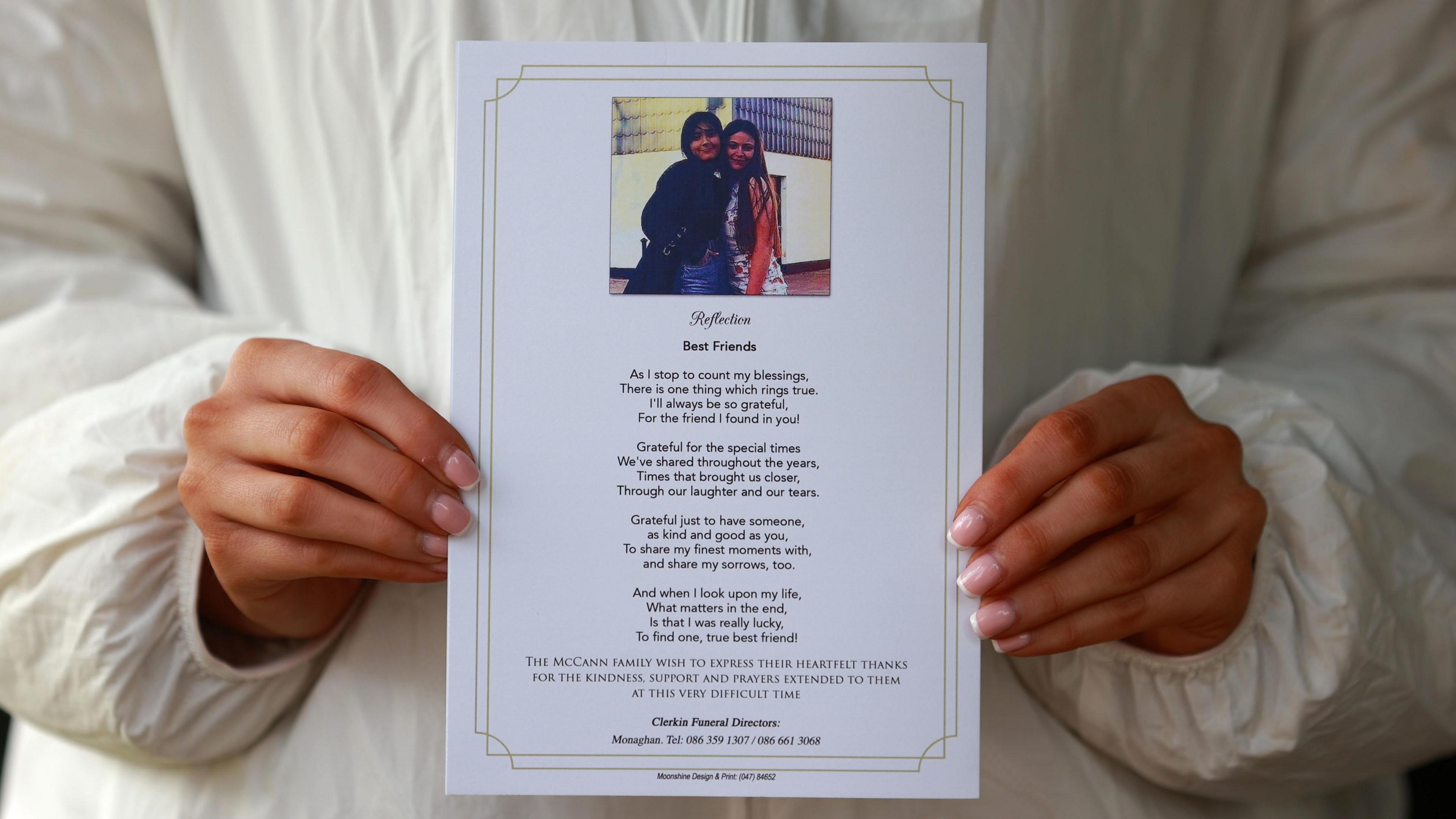 Someone holding a funeral programme for Kiea McCann with a poem entitled Best Friends on its reverse