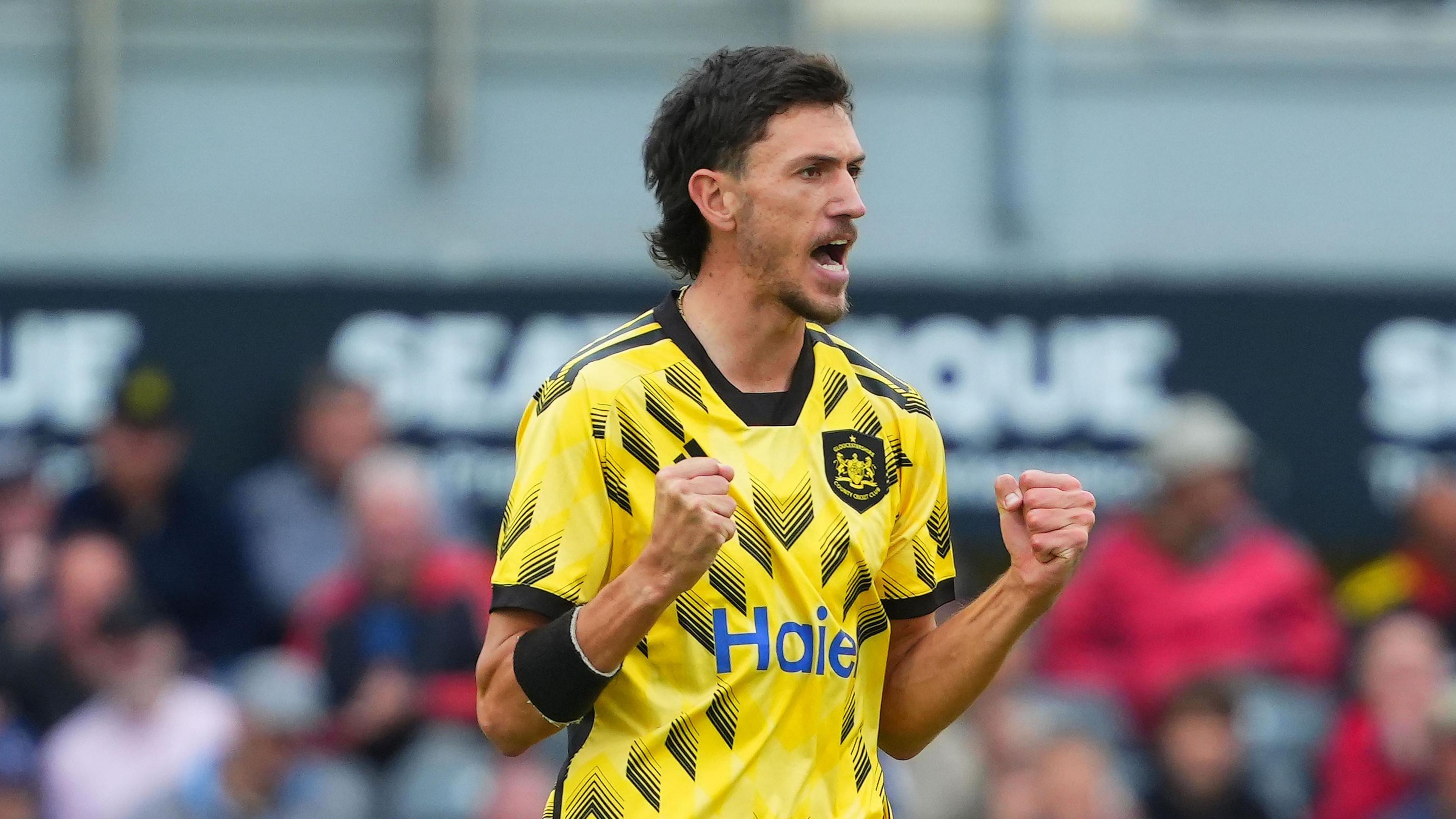 Gloucestershire's Duan Jansen celebrating while clenching his fists.
