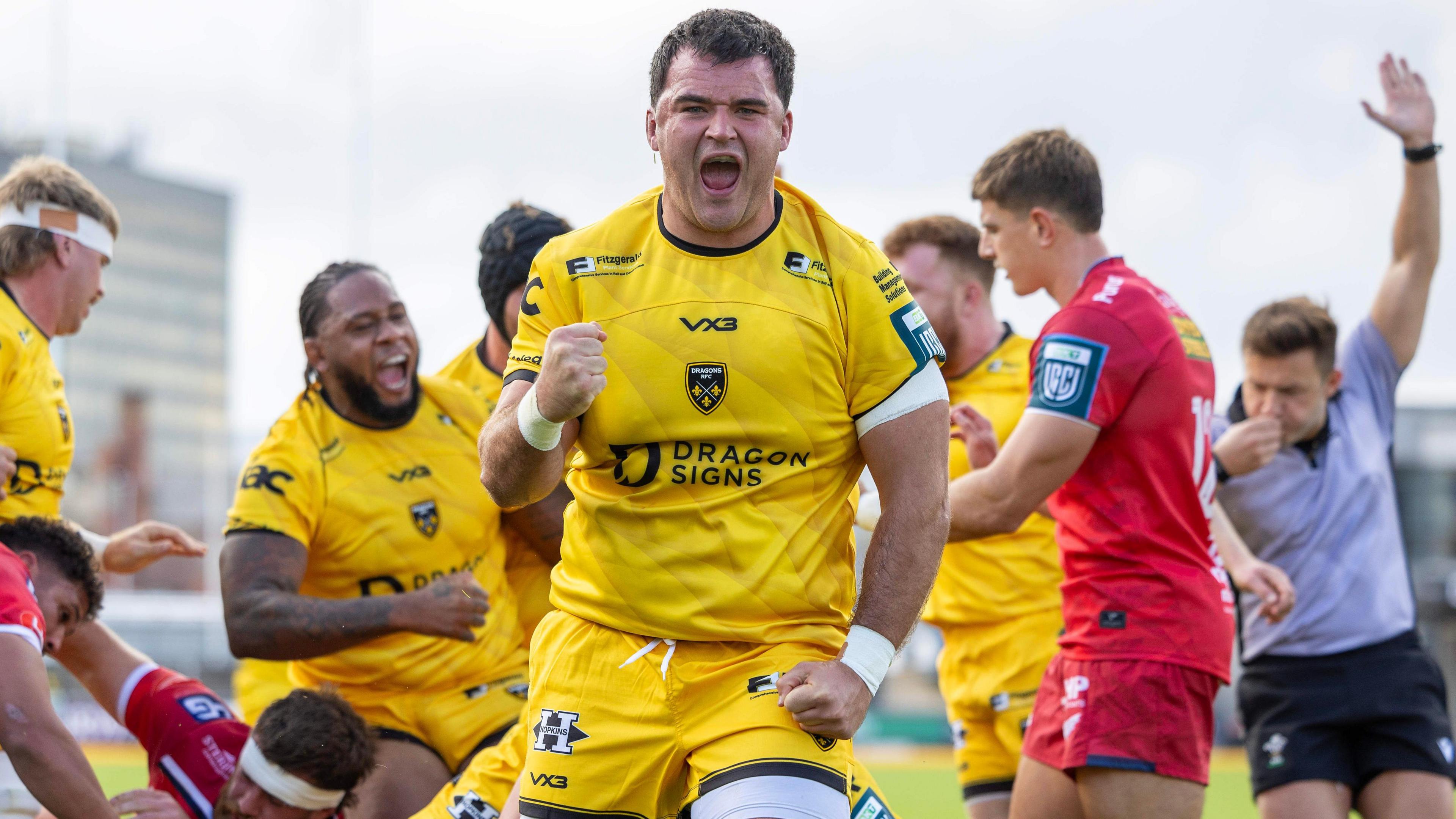 Dragons prop Chris Coleman celebrates a try against Scarlets in pre-season