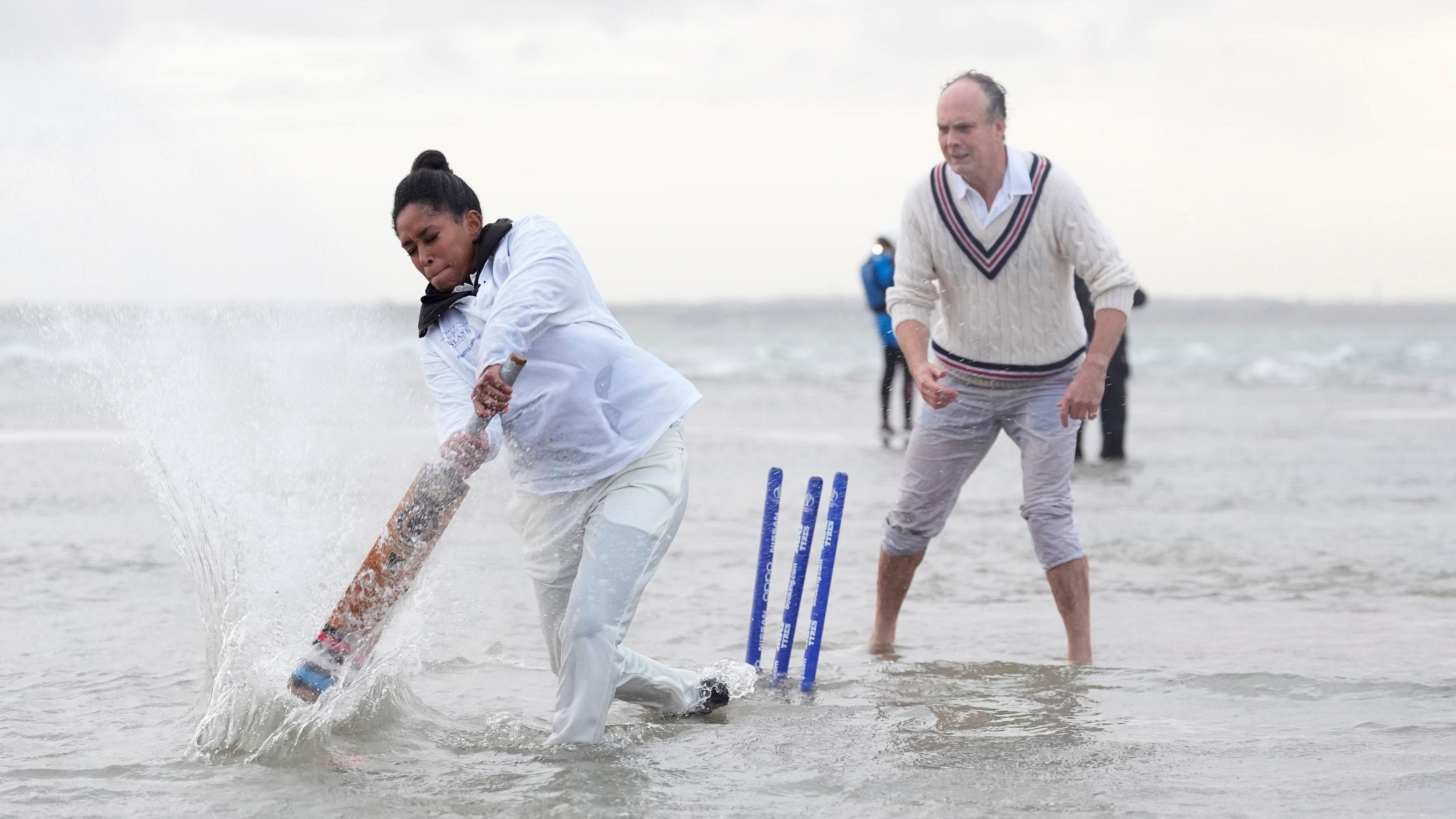 Ebony Rainford-Brent bats during the annual Brambles cricket match between members of the Royal Southern Yacht Club and the Island Sailing Club on the Bramble Bank sandbank in the middle of the Solent at low tide.