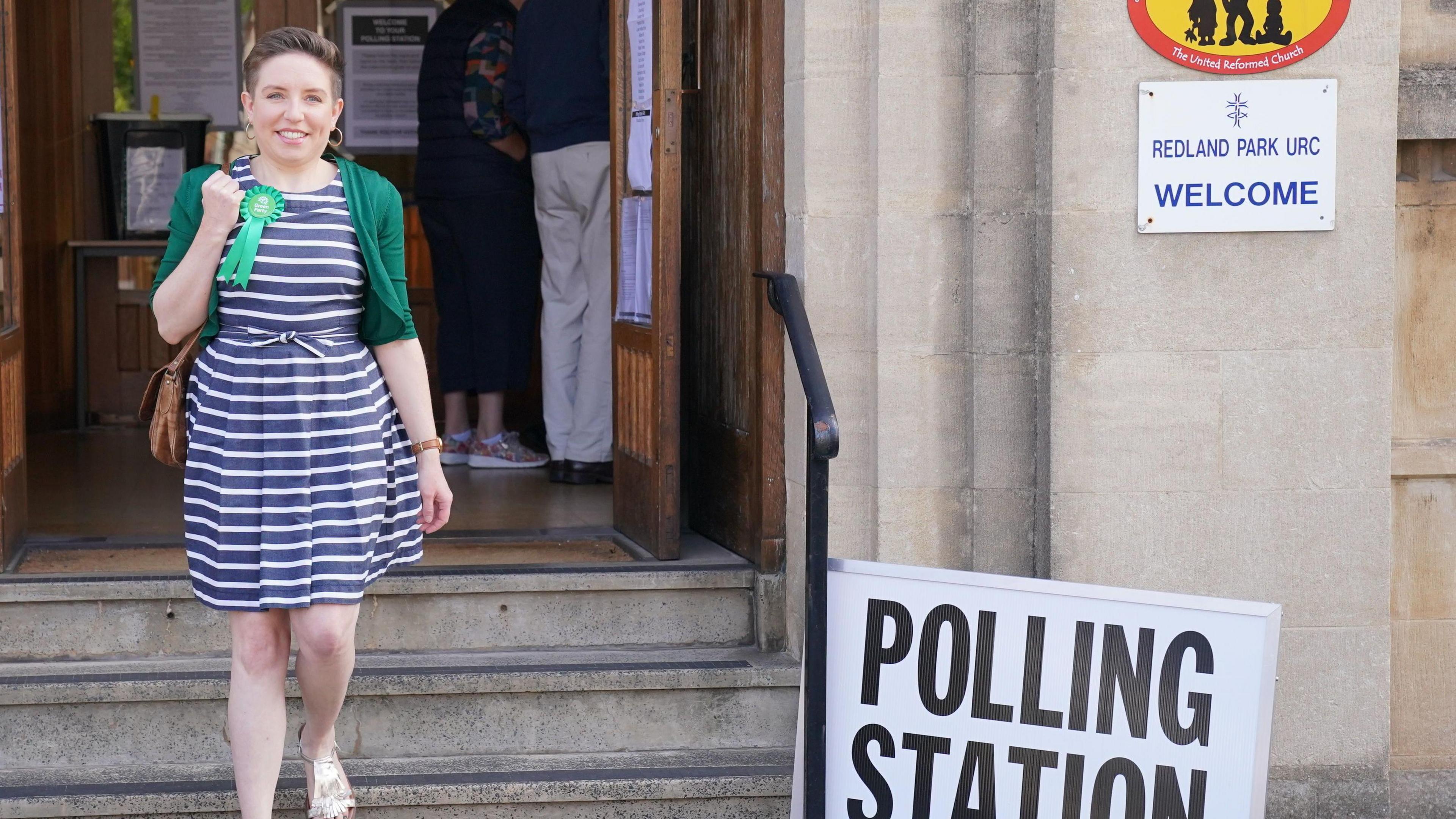 Carla Denyer walking down the steps outside a polling station in Redland