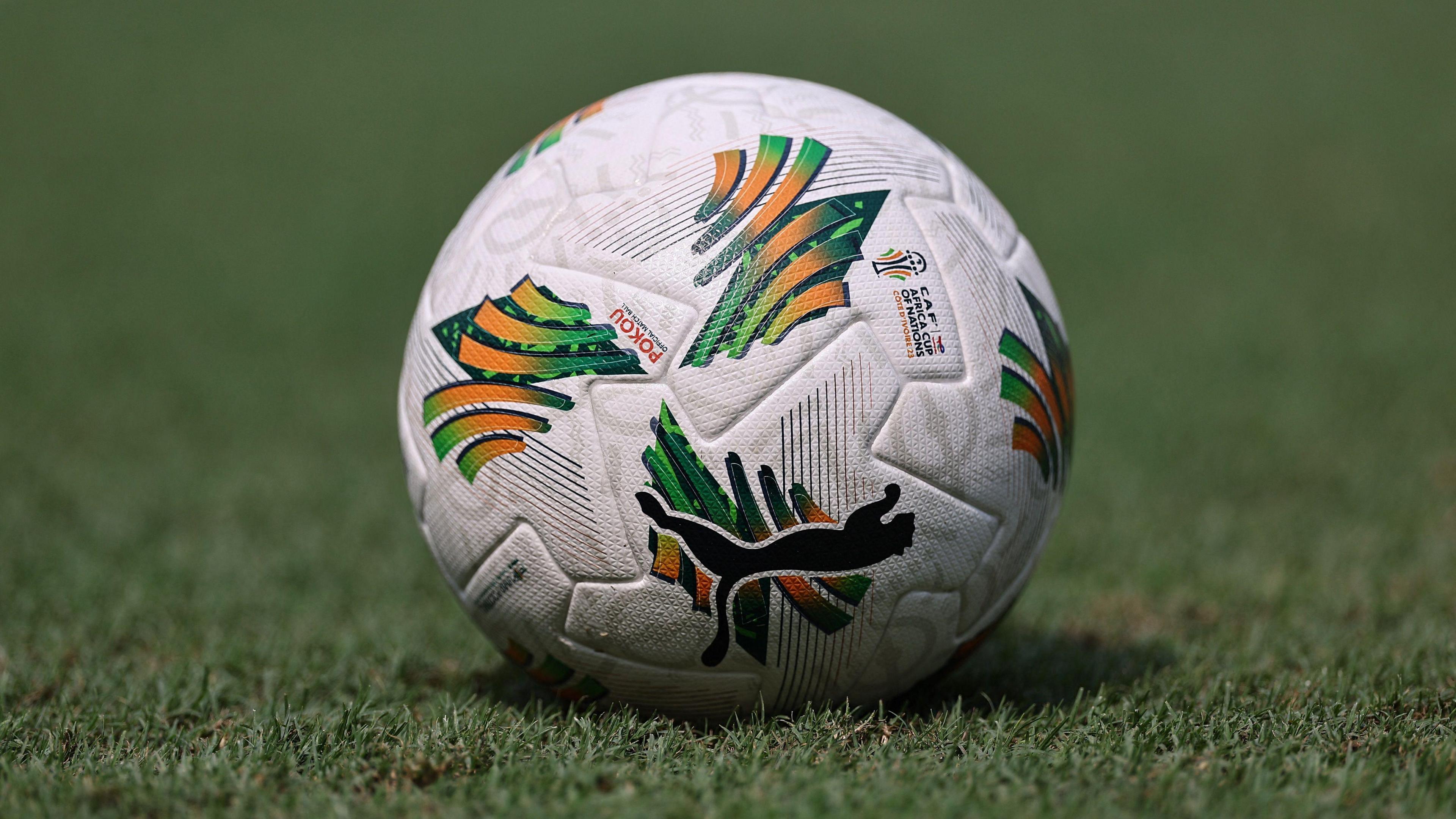 A football pictured on grass