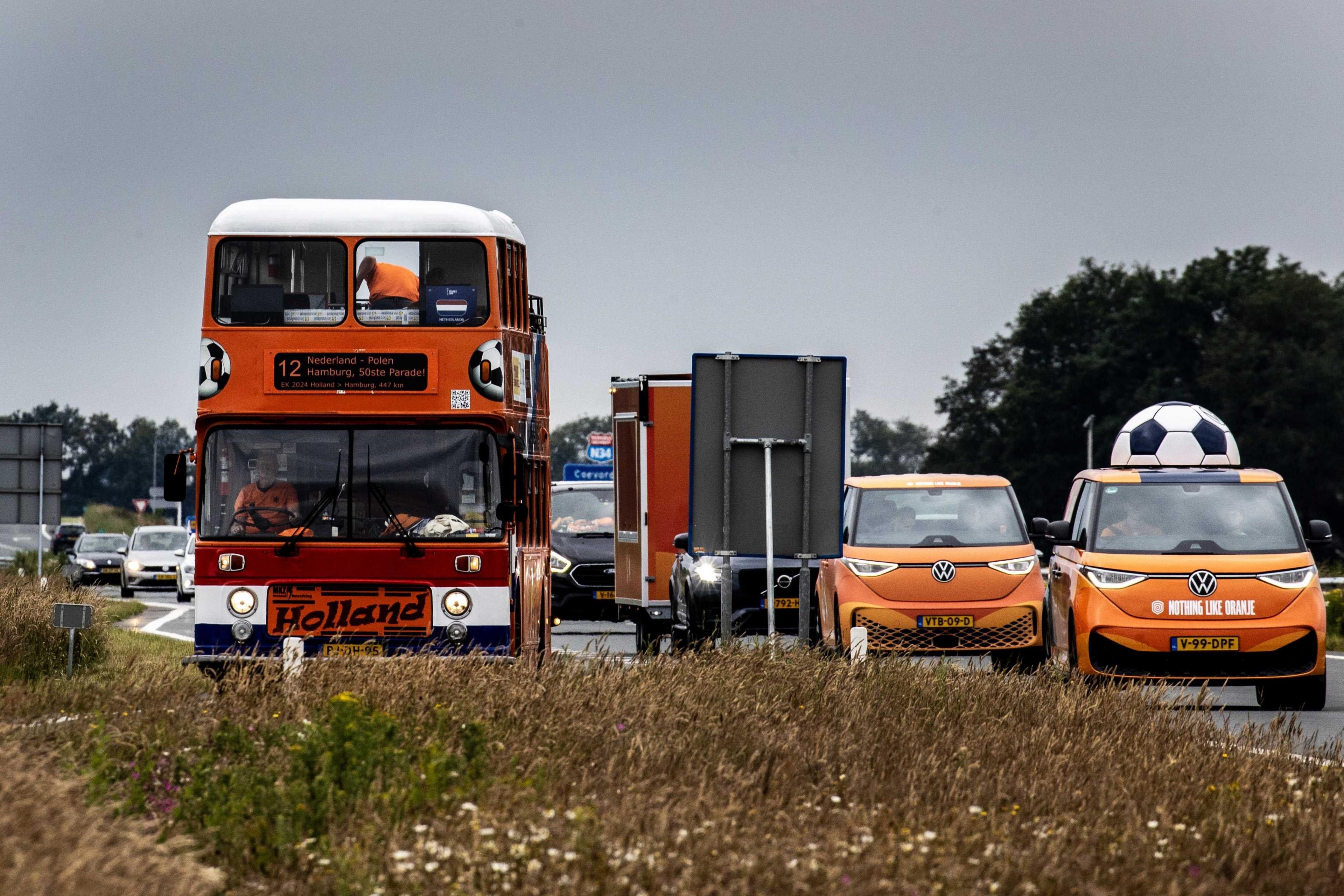 Dutch fans travel to Germany in an orange convoy of vehicles