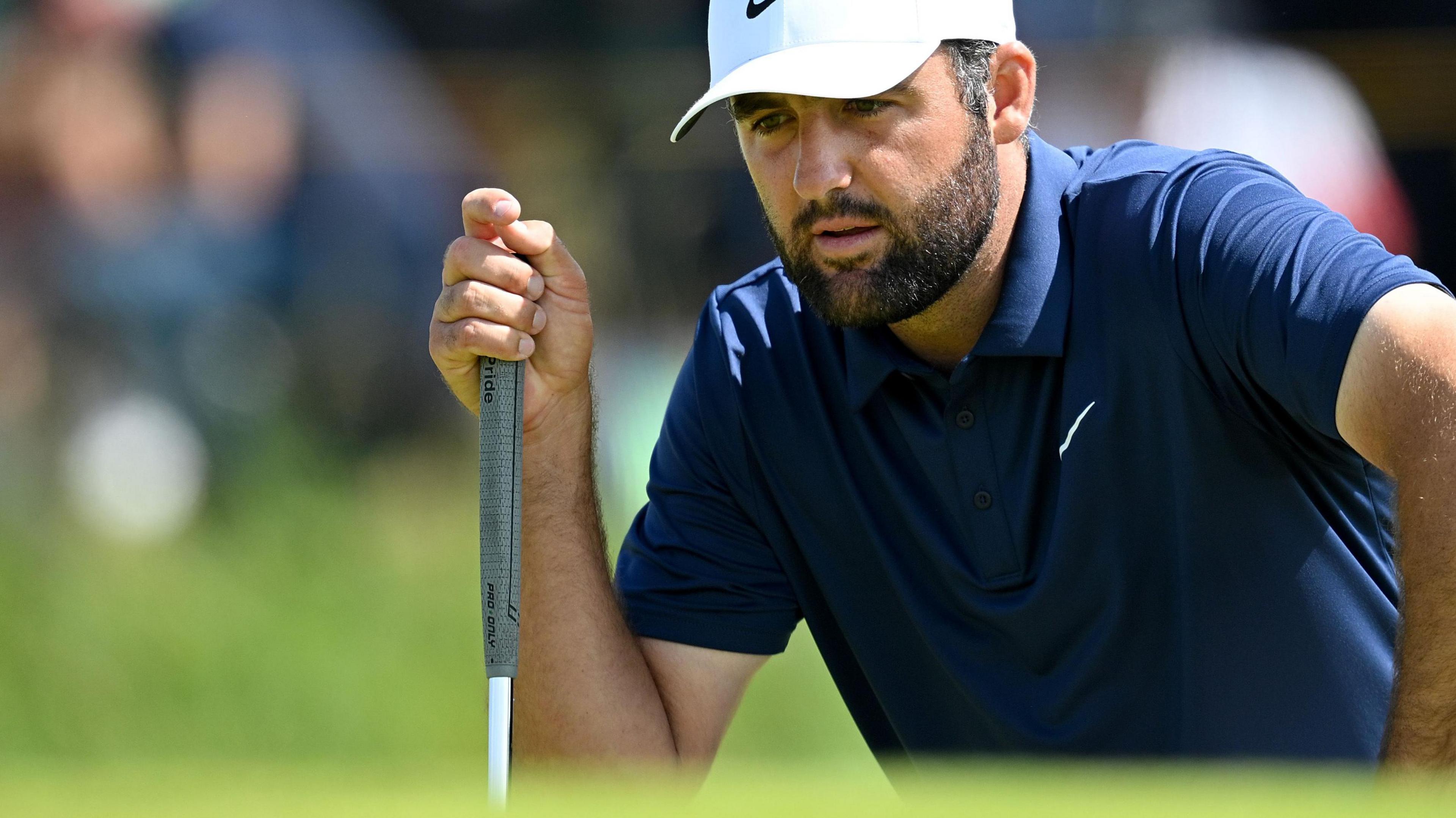Scottie Scheffler lining up a putt in the final round at Royal Portrush