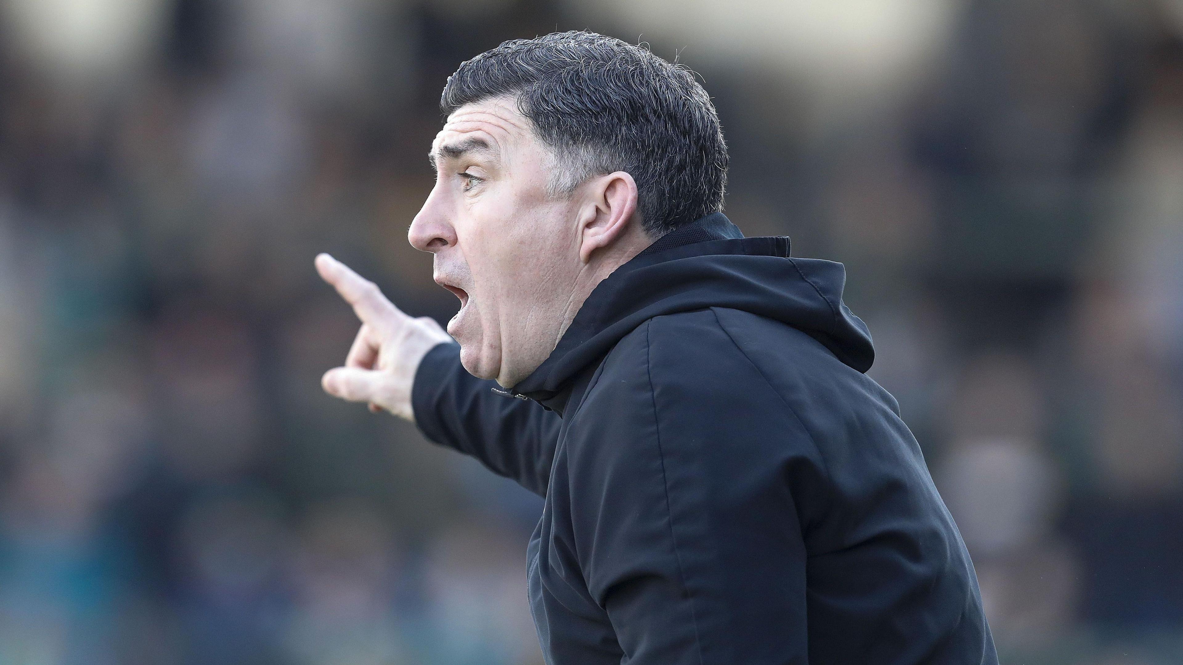 Southend United manager Kevin Maher shouts instructions to his players 