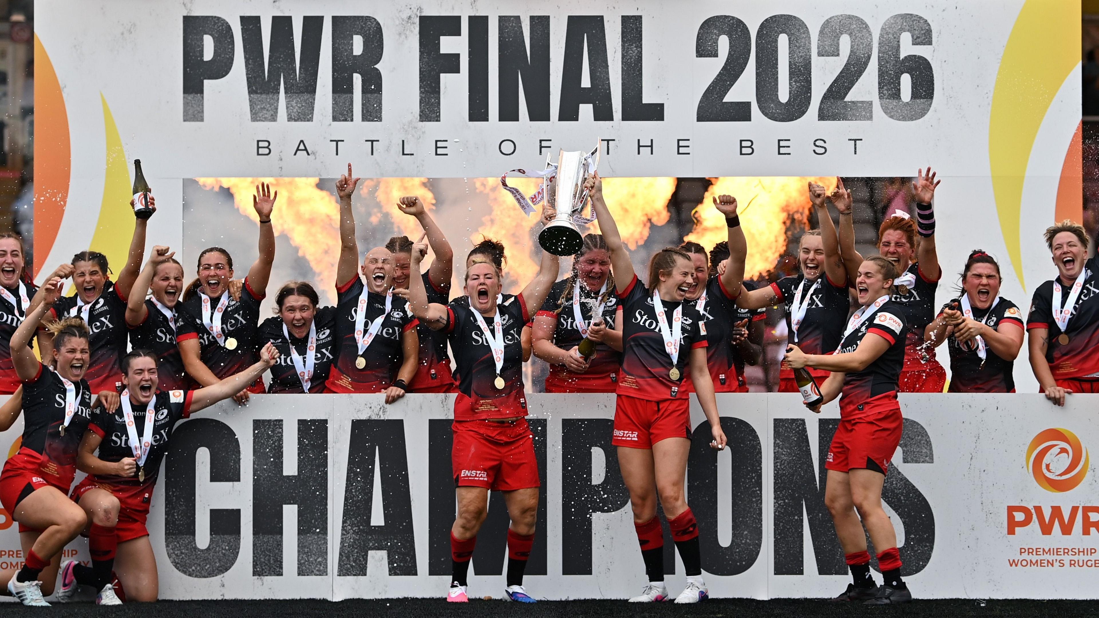 Marlie Packer and Zoe Harrison of Saracens lift the PWR trophy in celebration following the Premiership Women's Rugby Final match between Saracens Women and Ealing Trailfinders at Twickenham Stoop