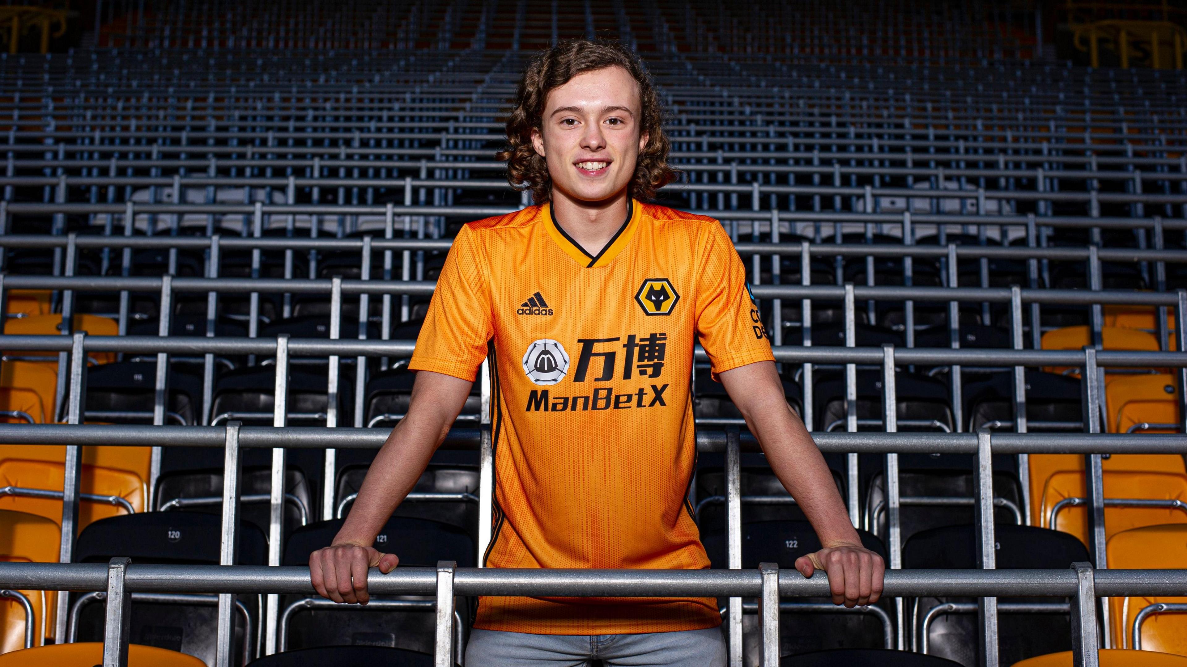 Luke Matheson poses after signing for Wolves
