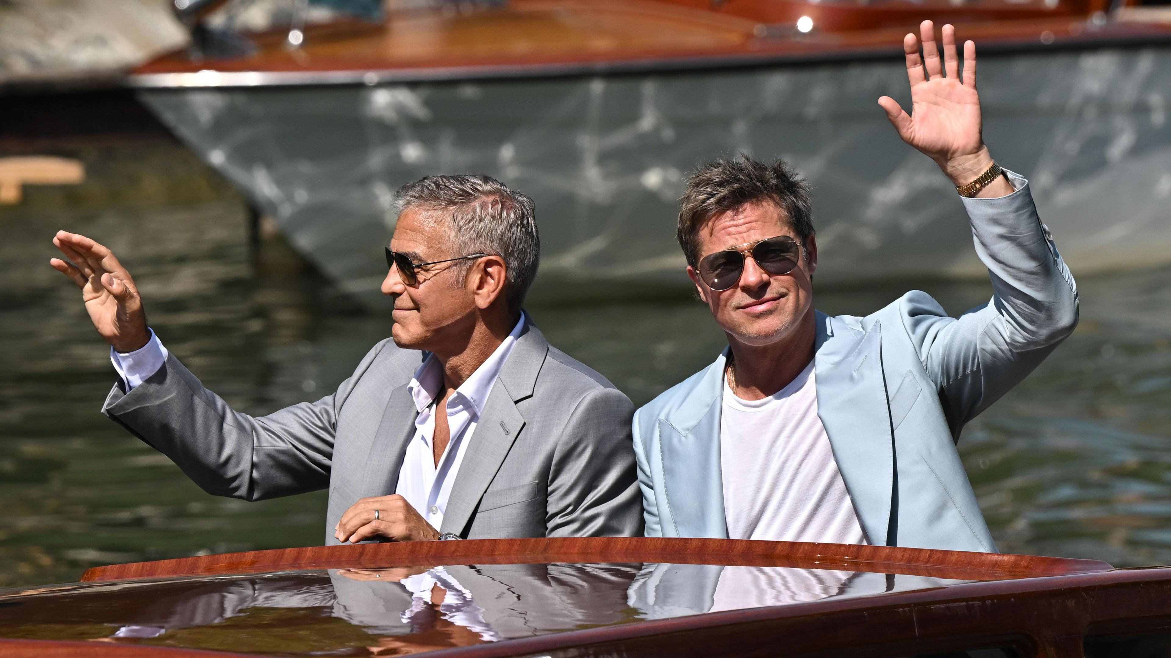 Cast members Brad Pitt and George Clooney arrive via boat to the premiere of "Wolfs" out of competition, at the 81st Venice Film Festival, Venice, Italy, September 1, 2024