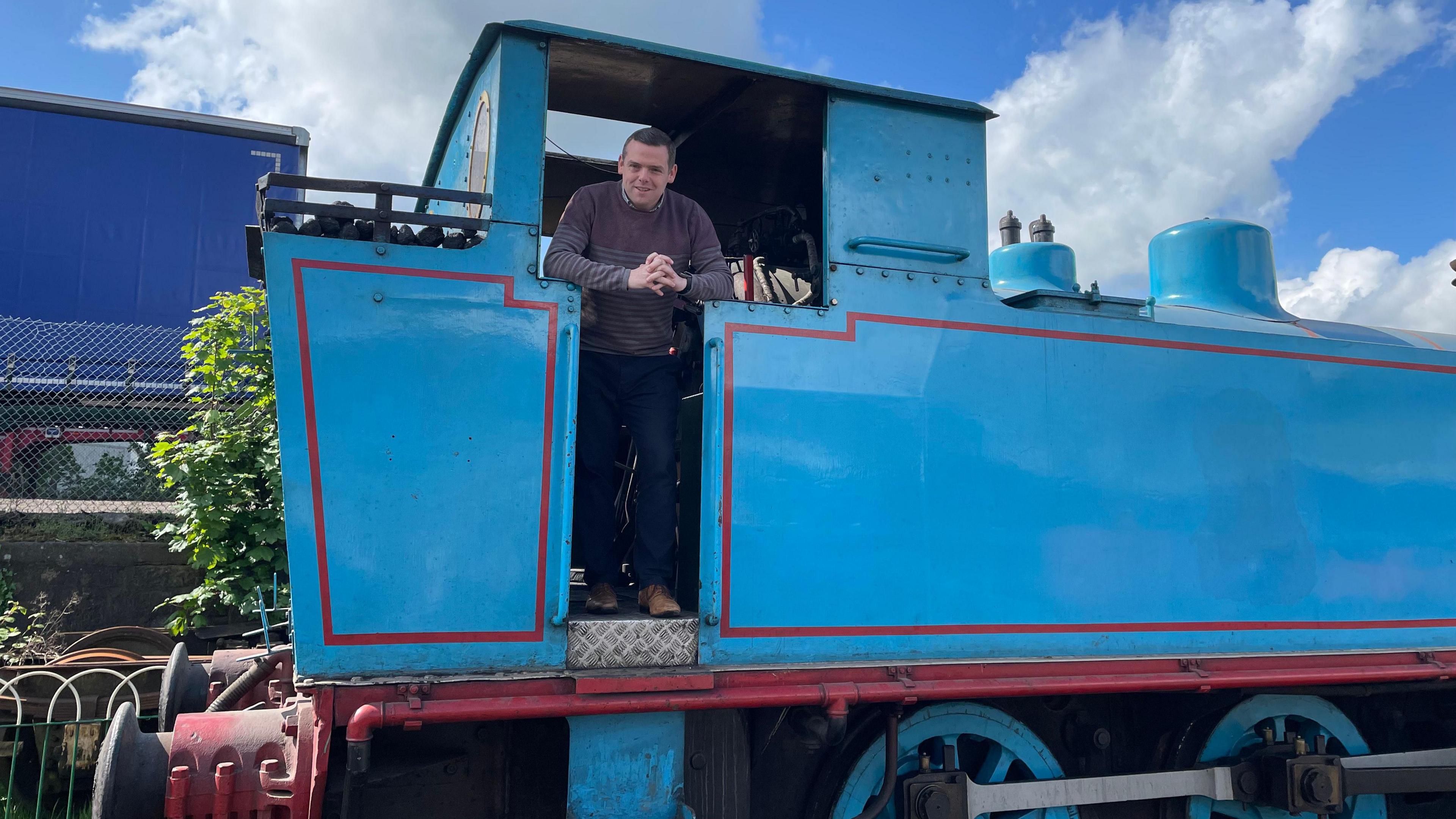 Douglas Ross on an old train