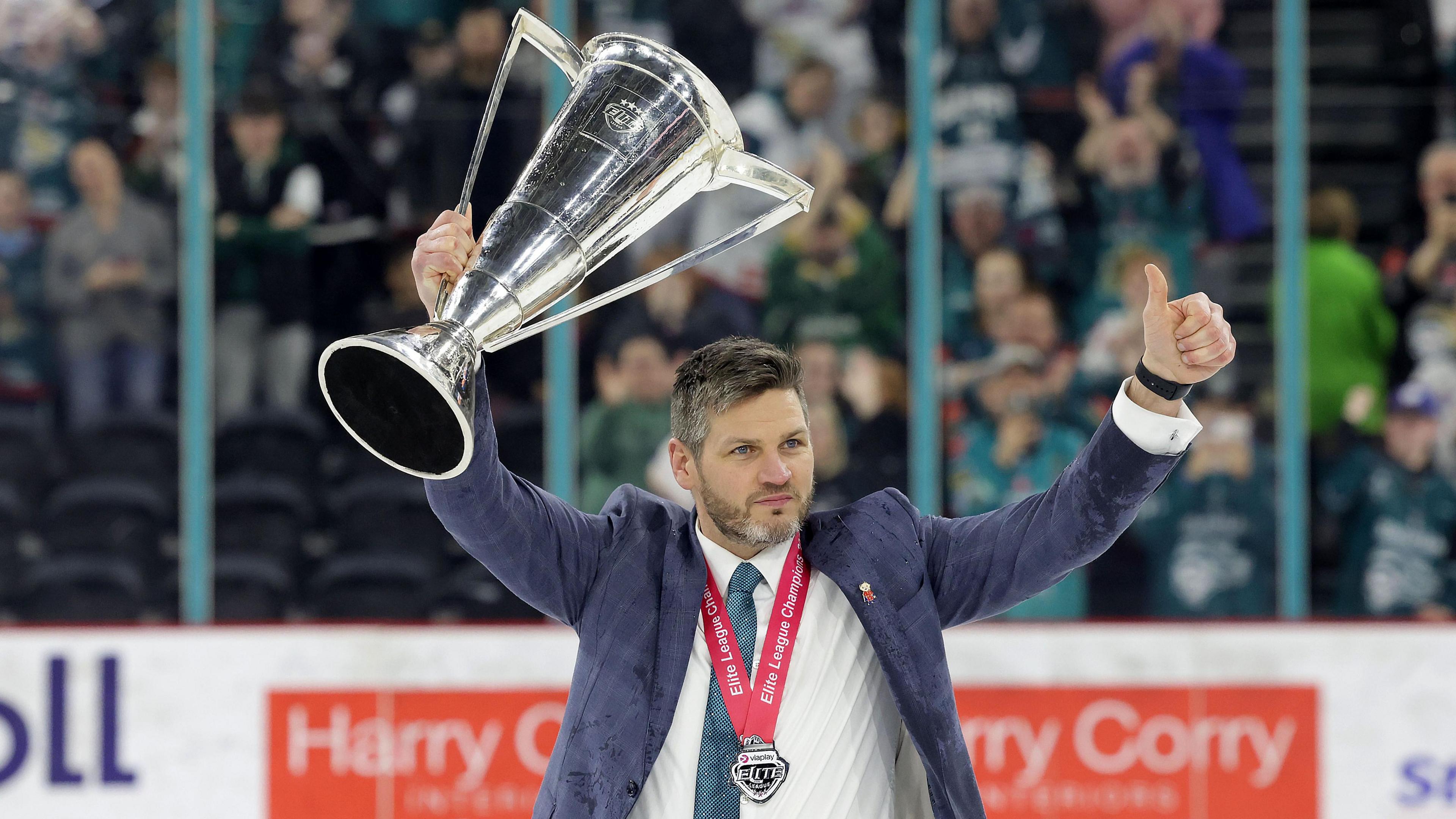 Adam Keefe holds the Elite League trophy aloft after guiding Belfast Giants to the title in the 2022-23 season