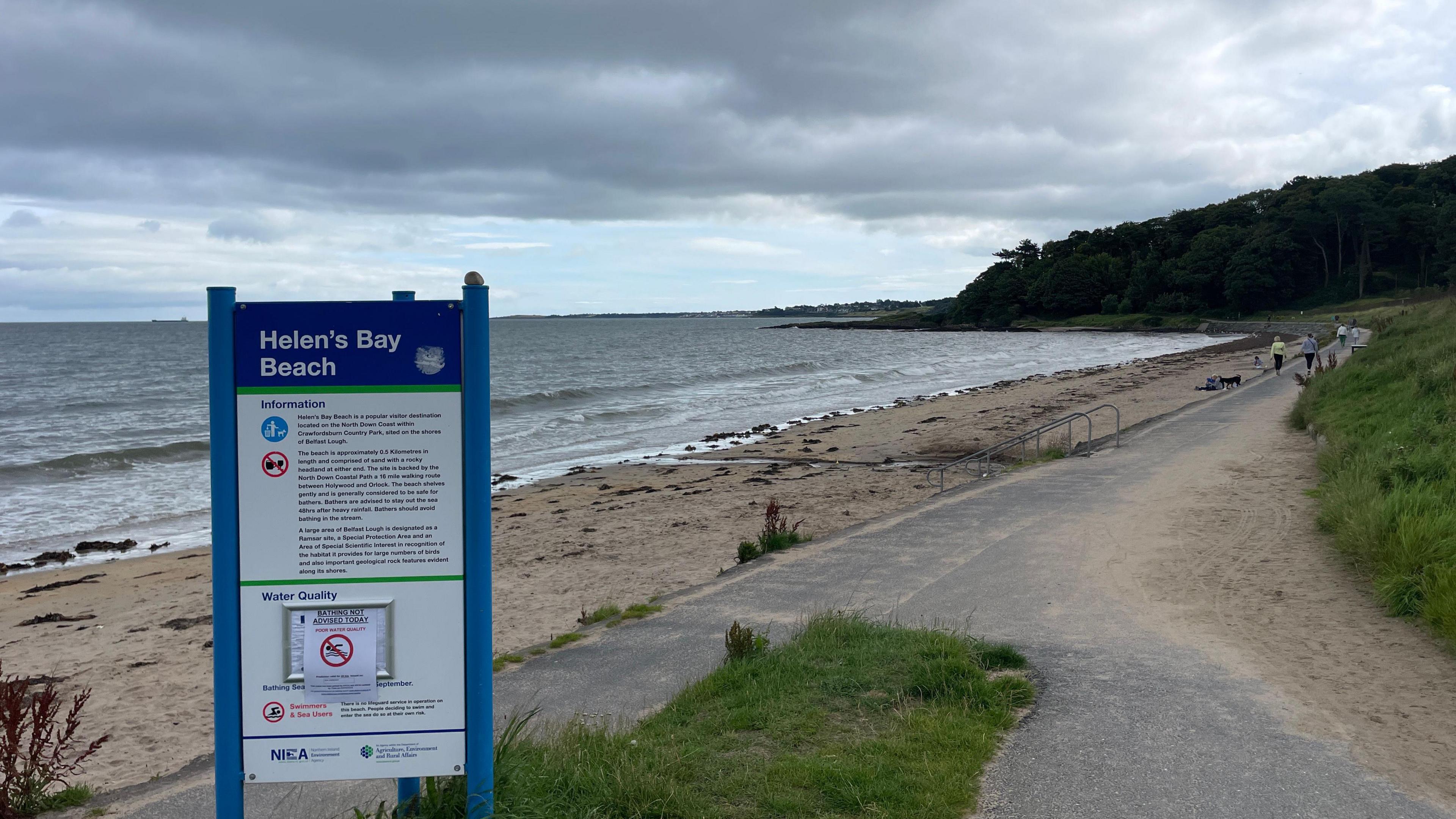 Image of a beach with a signpost that says "Helen's Bay"