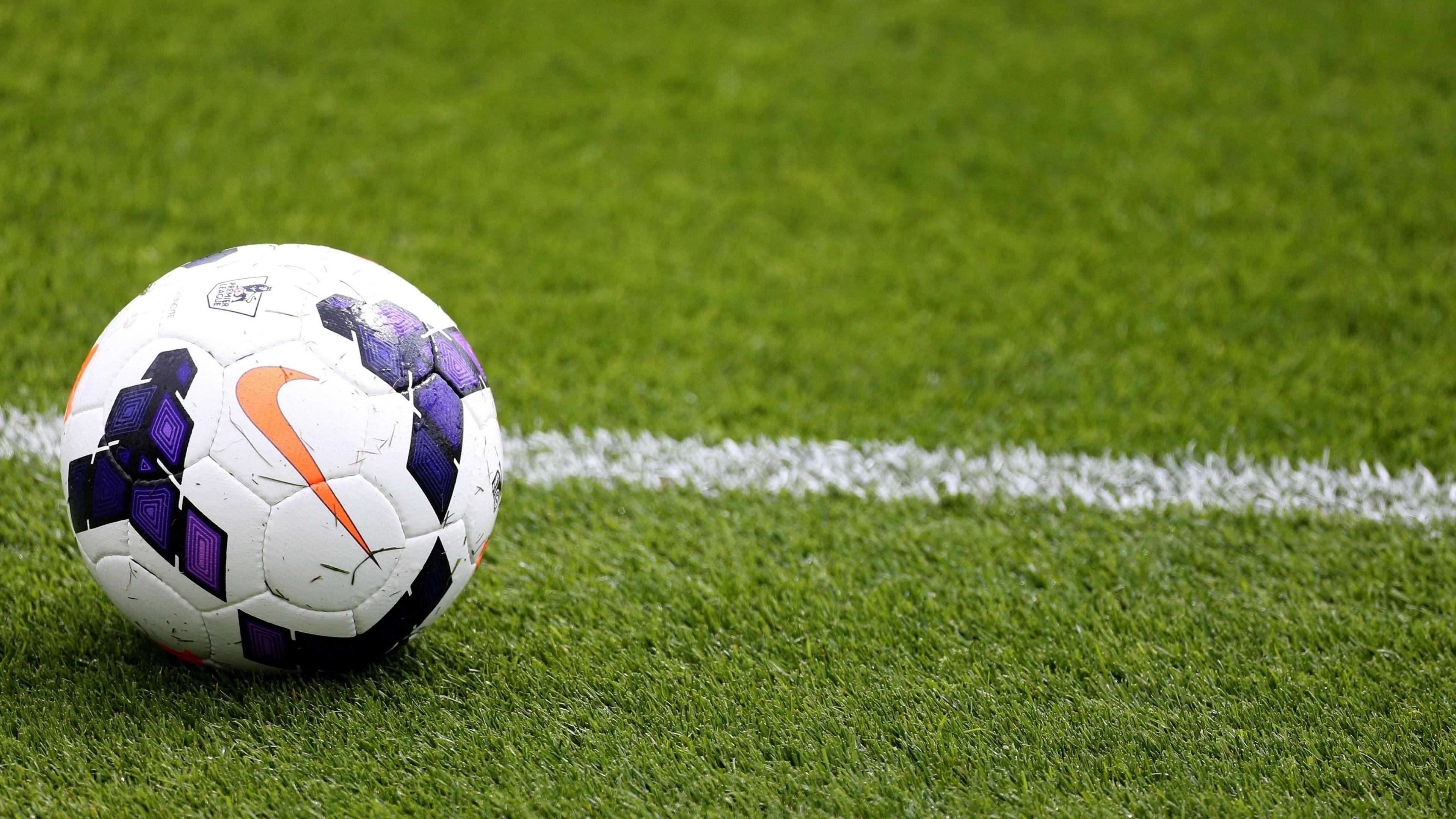 Football on a grass pitch