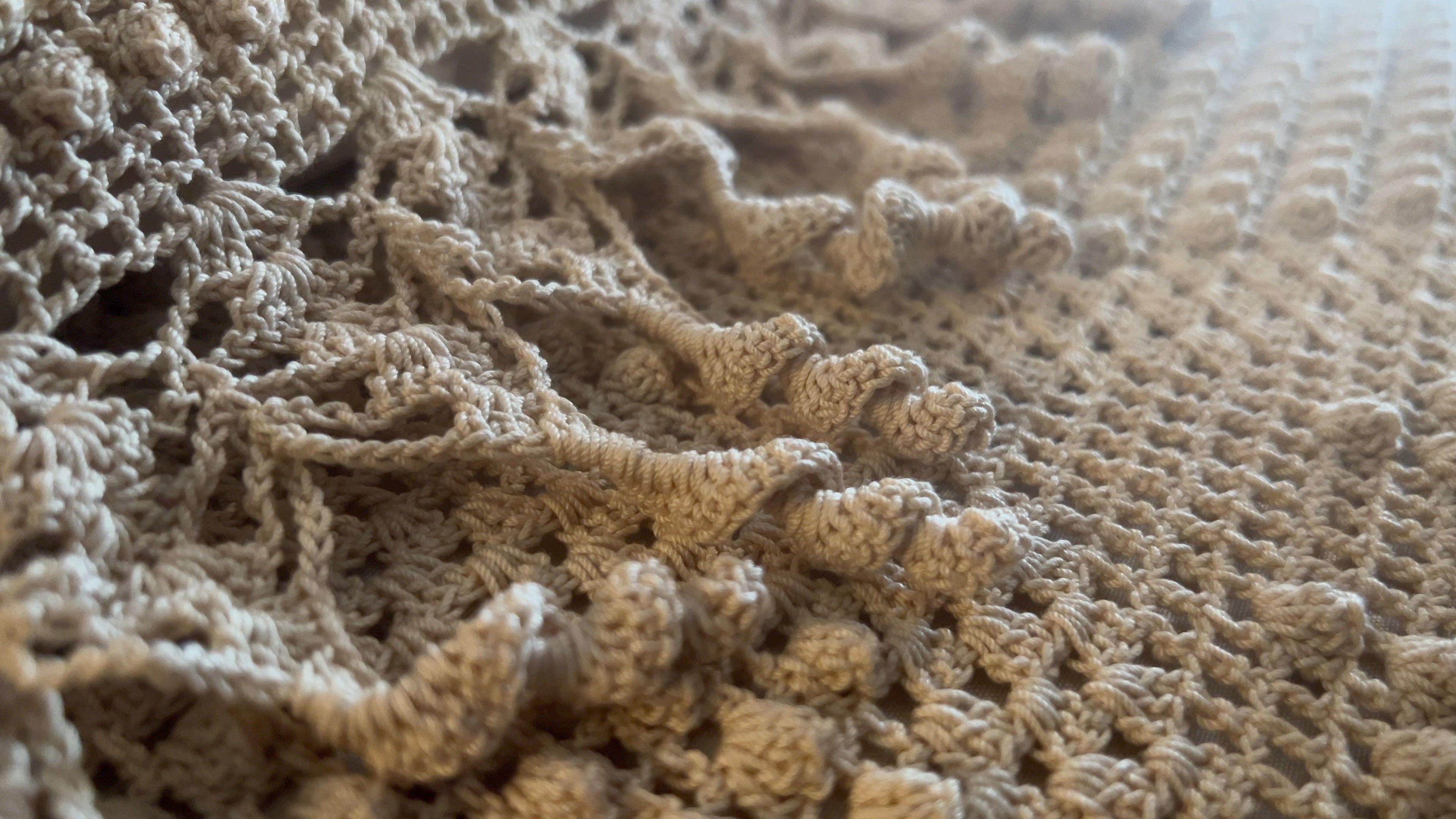 A close-up view of the Evonne Pavle's crochet bedspread