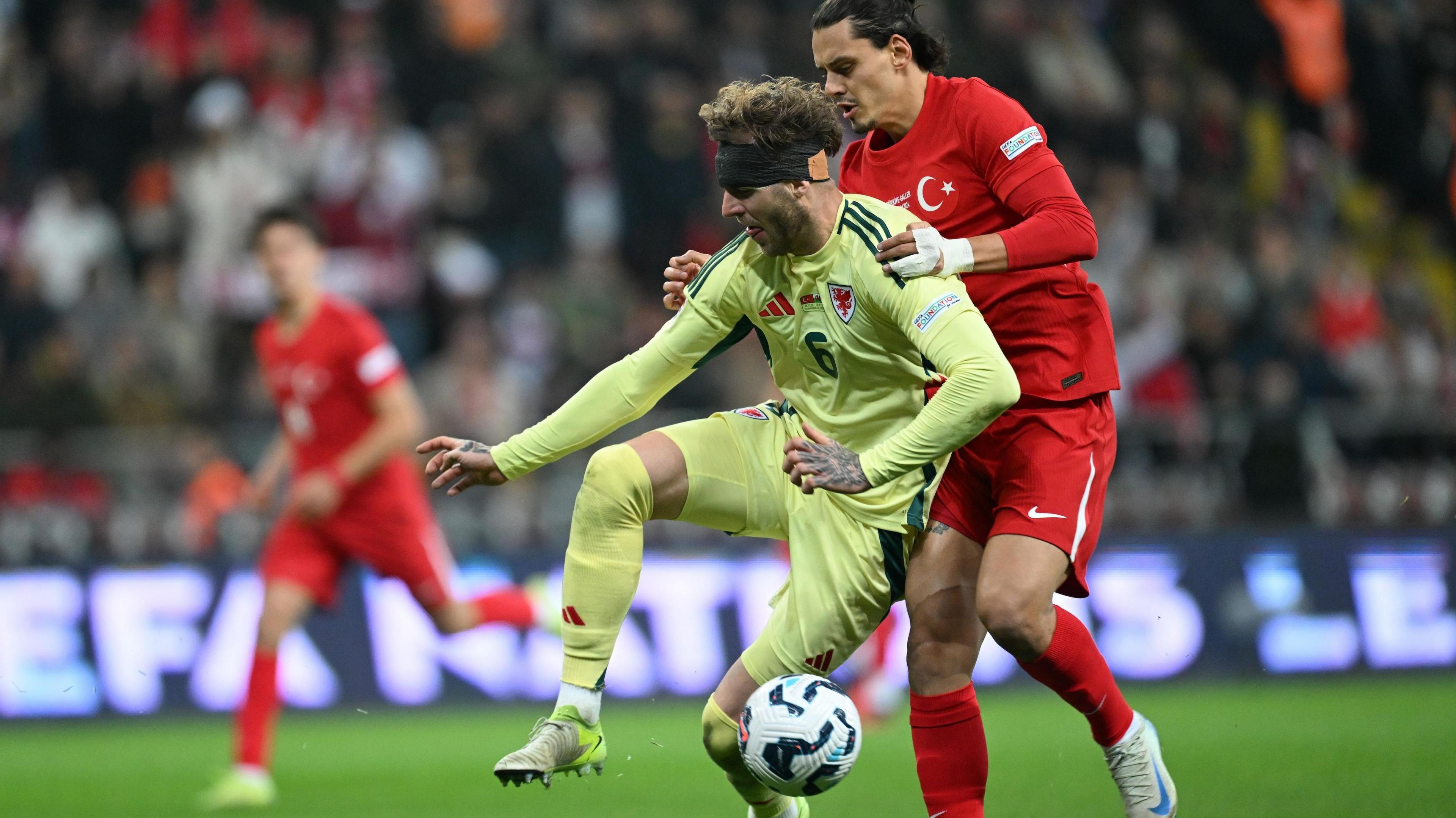 Enes Unal (R) of Turkiye and Joe Rodon (6) of Wales compete during the UEFA Nations B League Group 4 match between Turkiye and Wales at RGH EnerTurk Enerji Stadium in Kayseri, Turkiye on November 16, 2024.