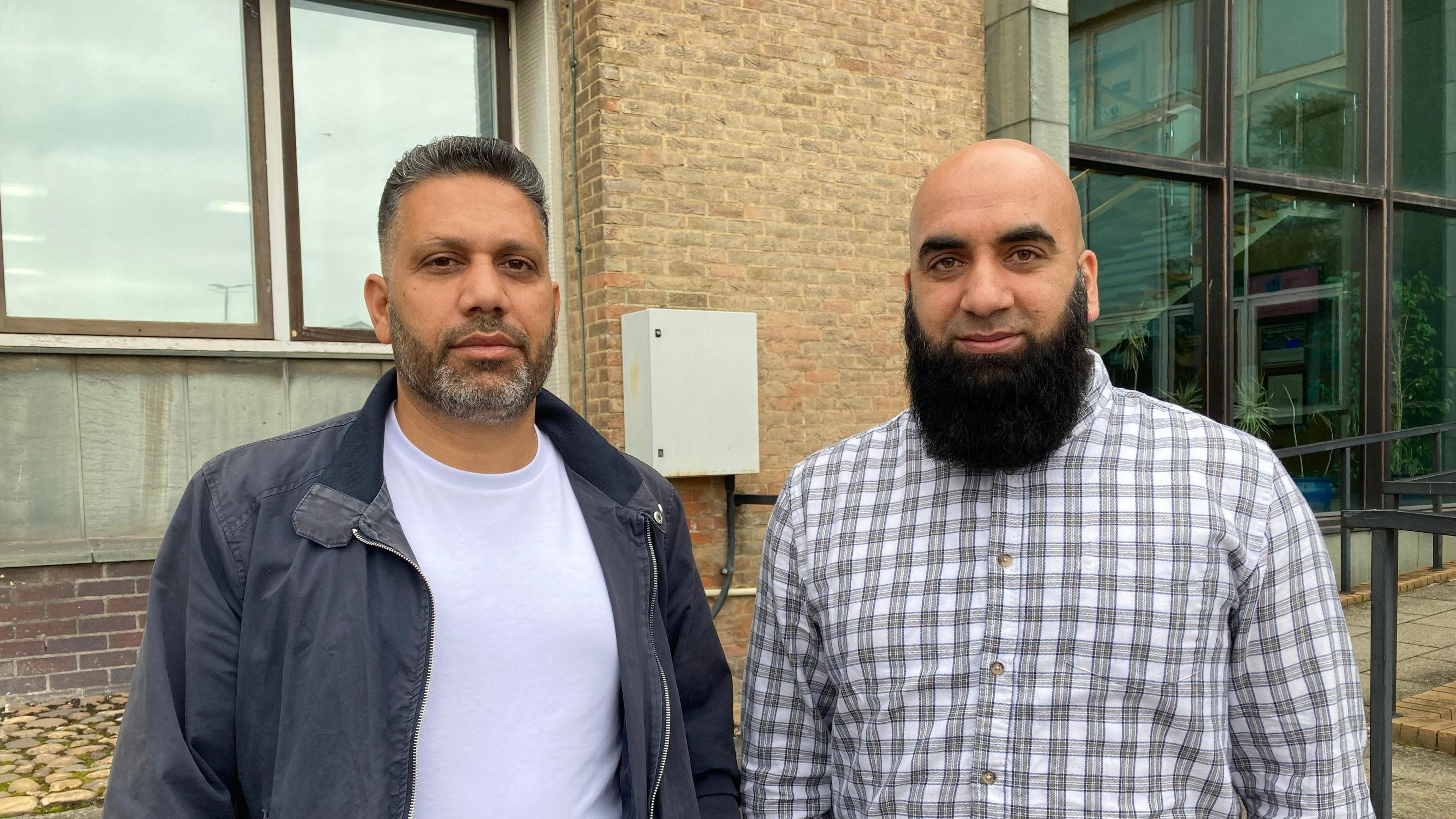 Councillors Shakeel Hussain, wearing a black jacket and a white top, and Sufi Mubeen, wearing a checked top. 