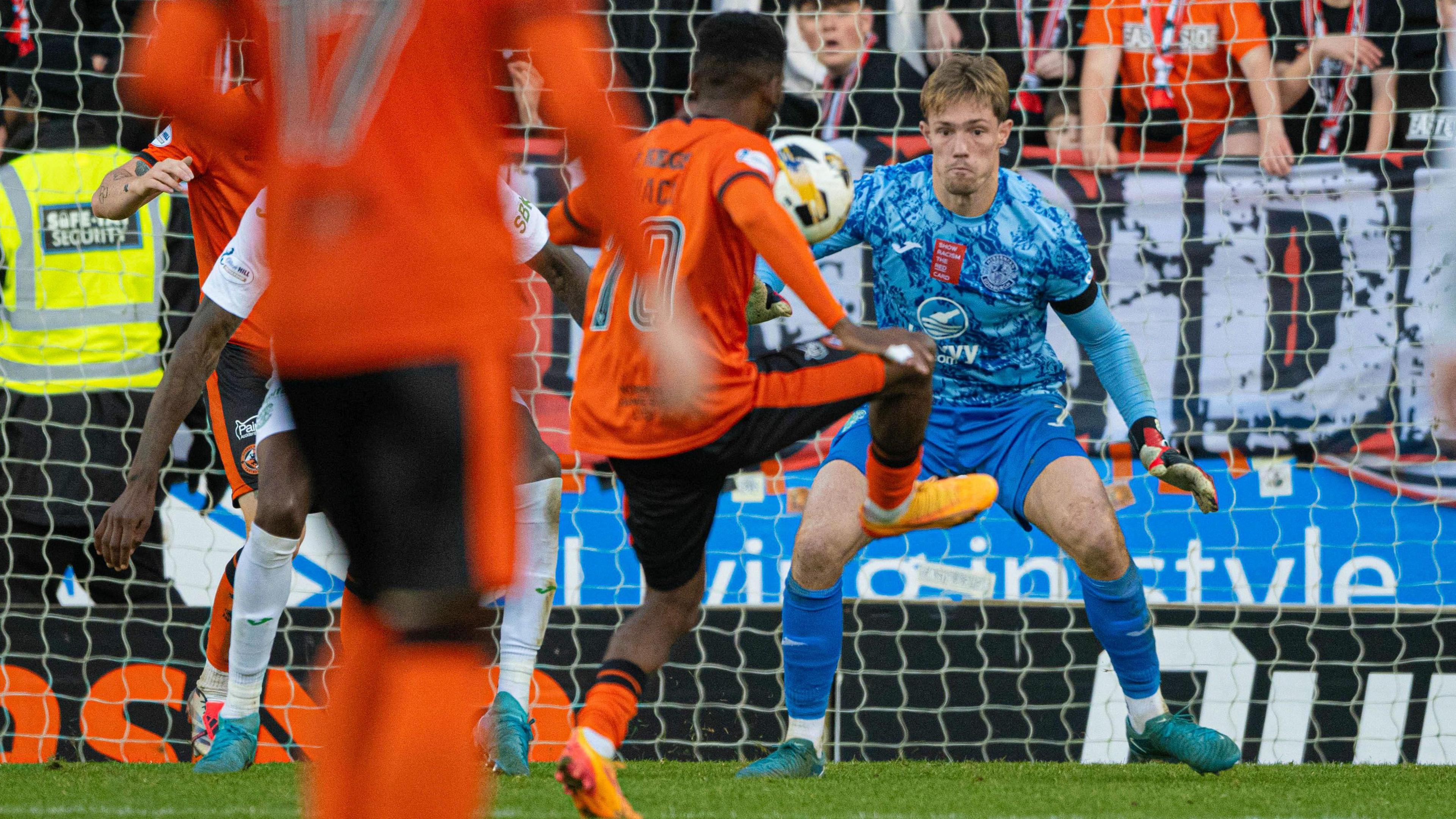 Dundee United's Meshack Ubochioma scores against Hibernian