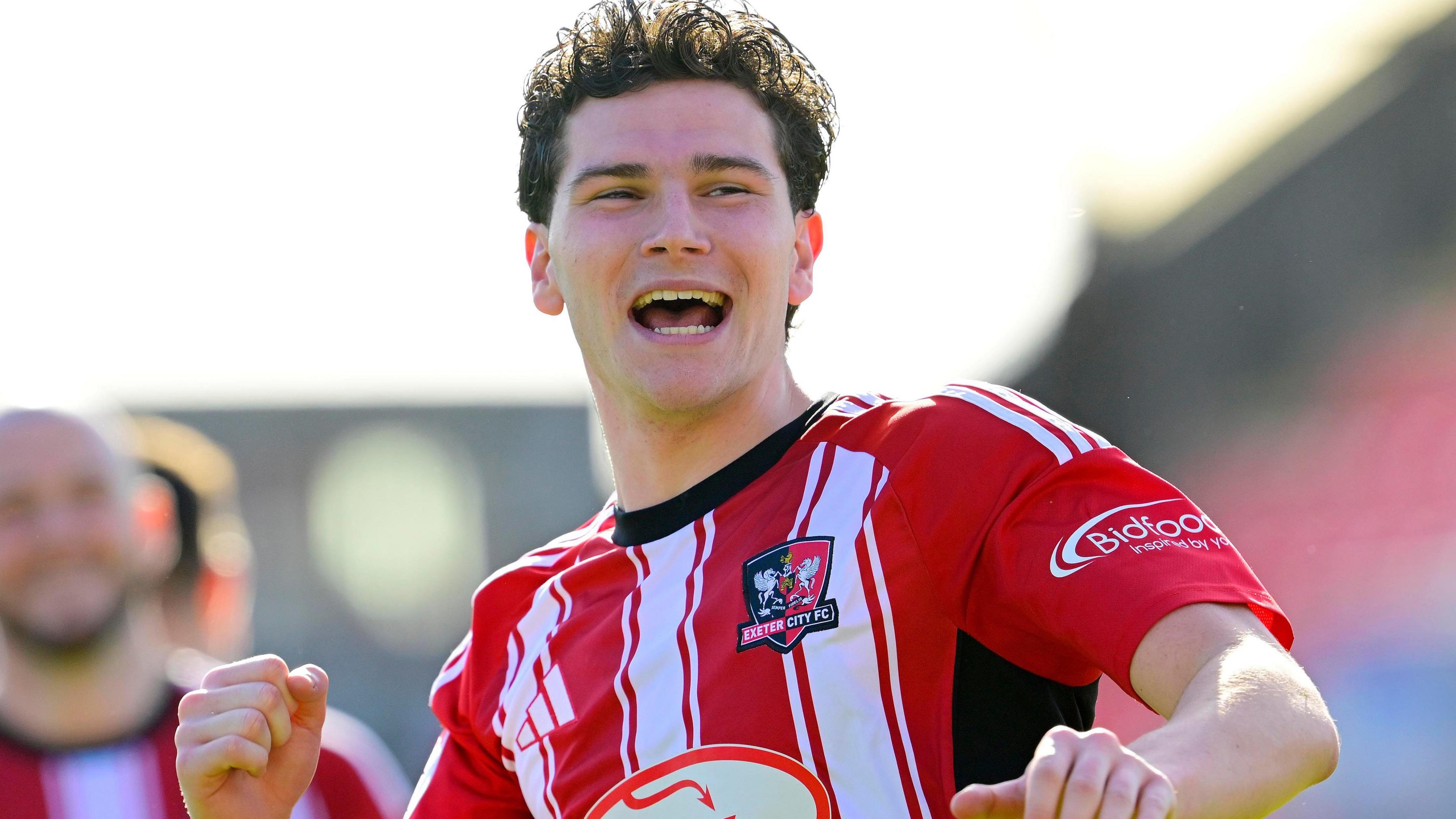 Ed James celebrating after Exeter beat Doncaster.