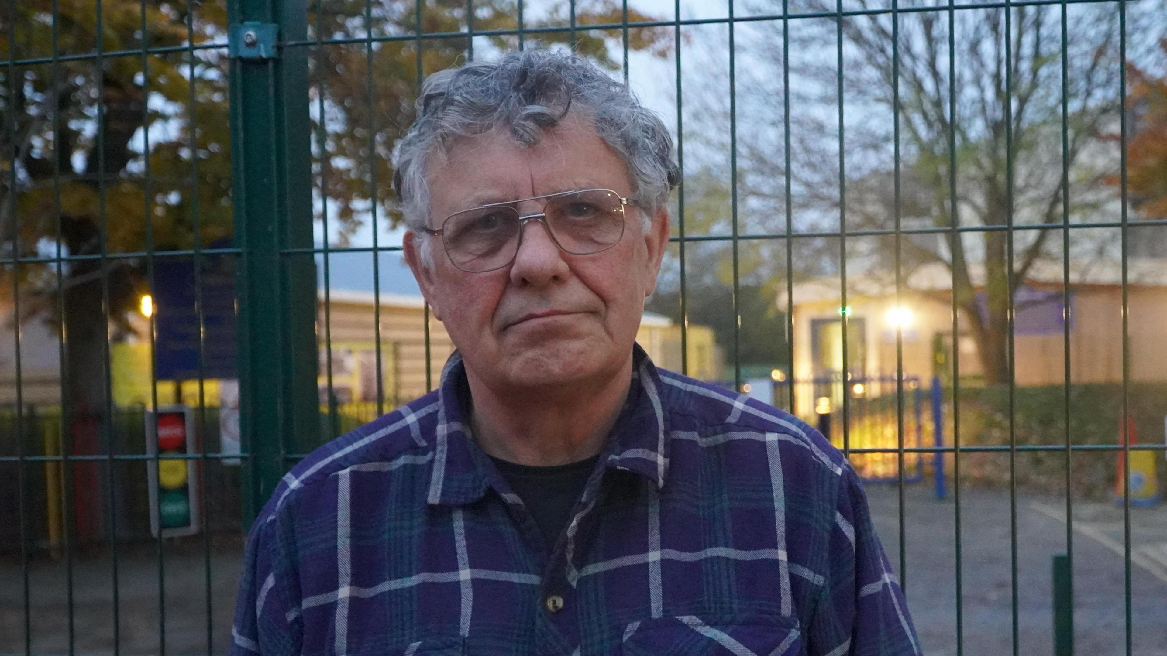 Andrew McCulloch, with short grey hair and glasses, looking directly into the camera.