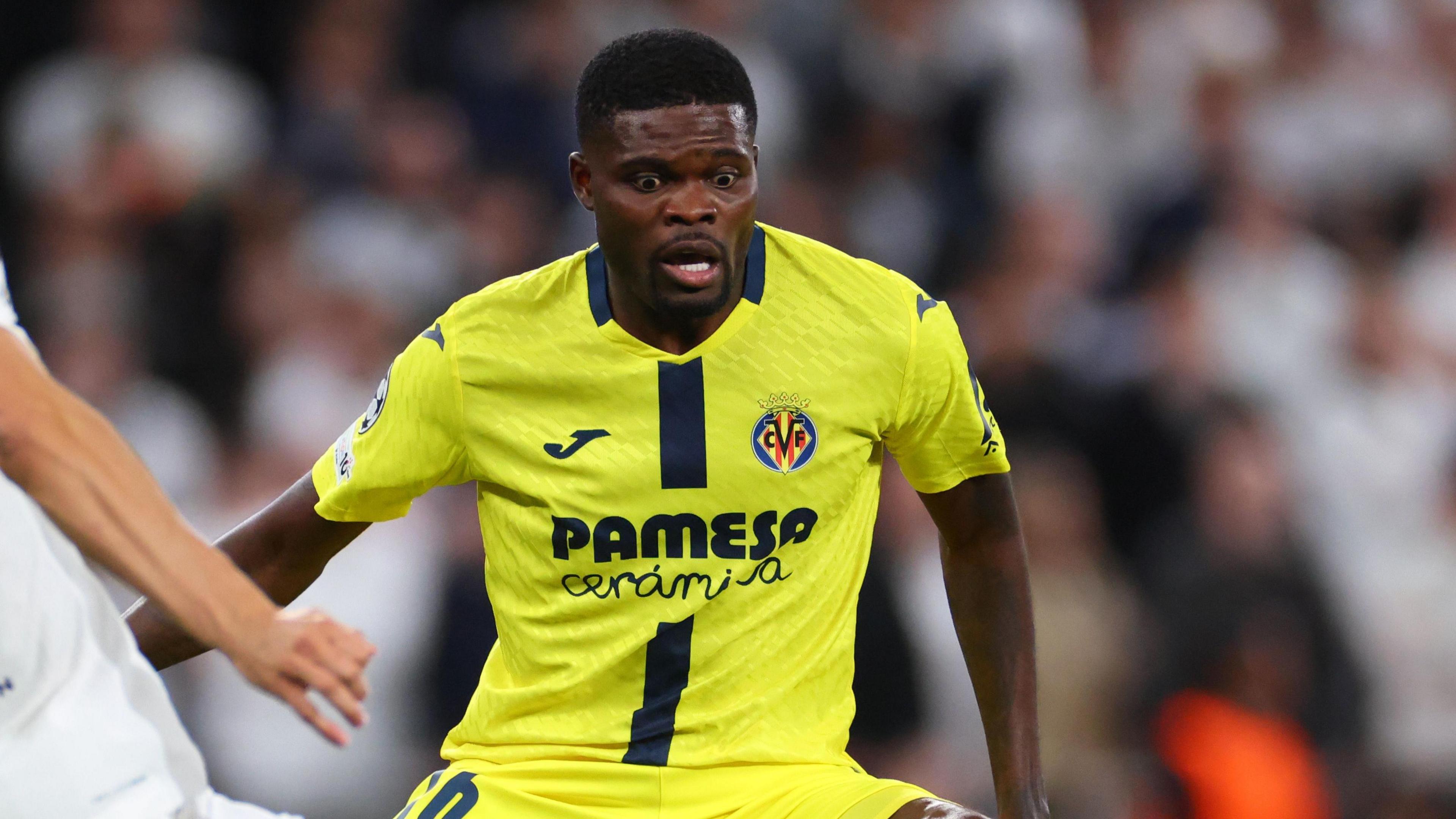Thomas Partey challenges Tottenham's Joao Palhinha for the ball during Villarreal's Champions League fixture with Tottenham